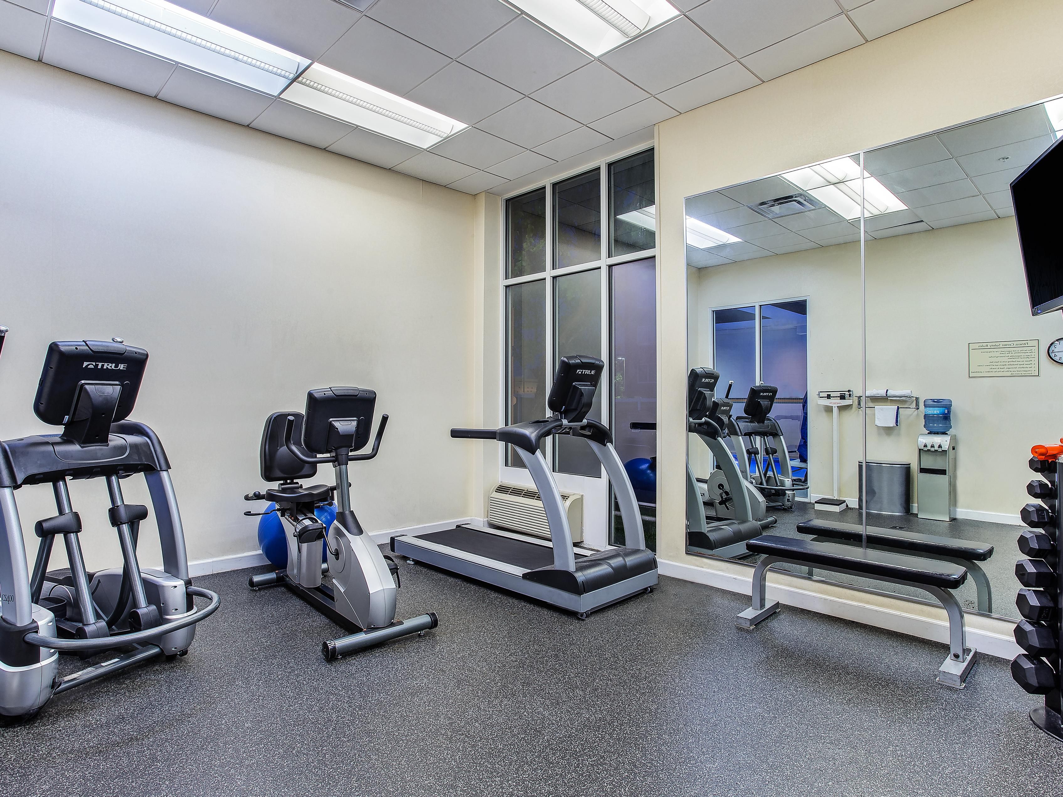 Our 24 hour fitness center features free weights, elliptical station, treadmill, stationary bike and weight bench.