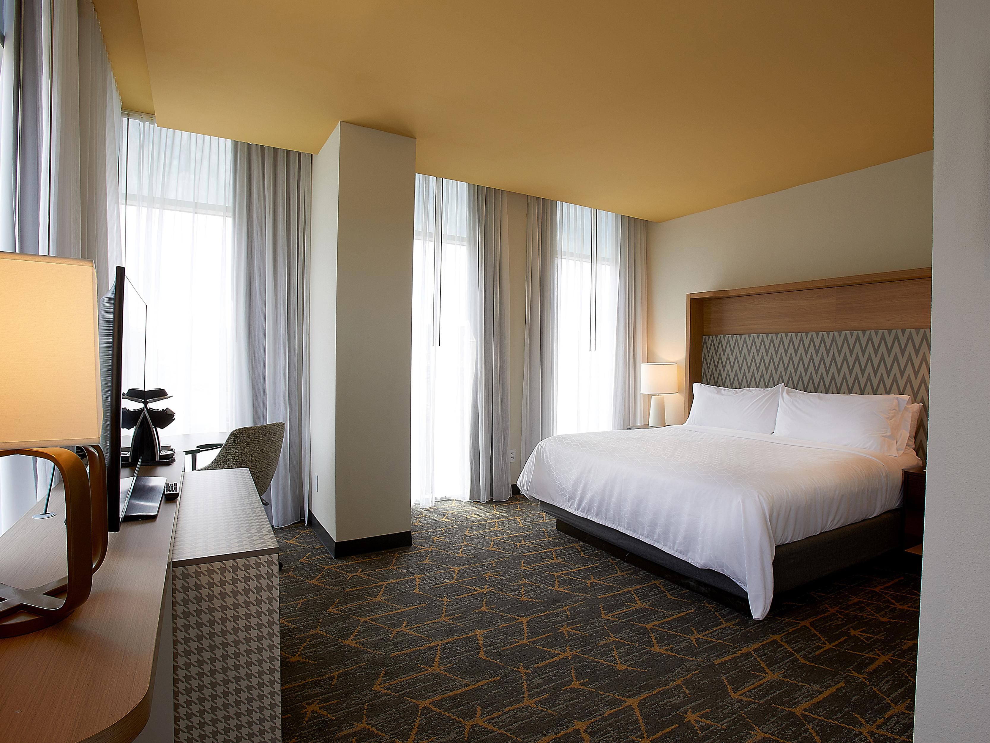 This king bed guest room features a street view.