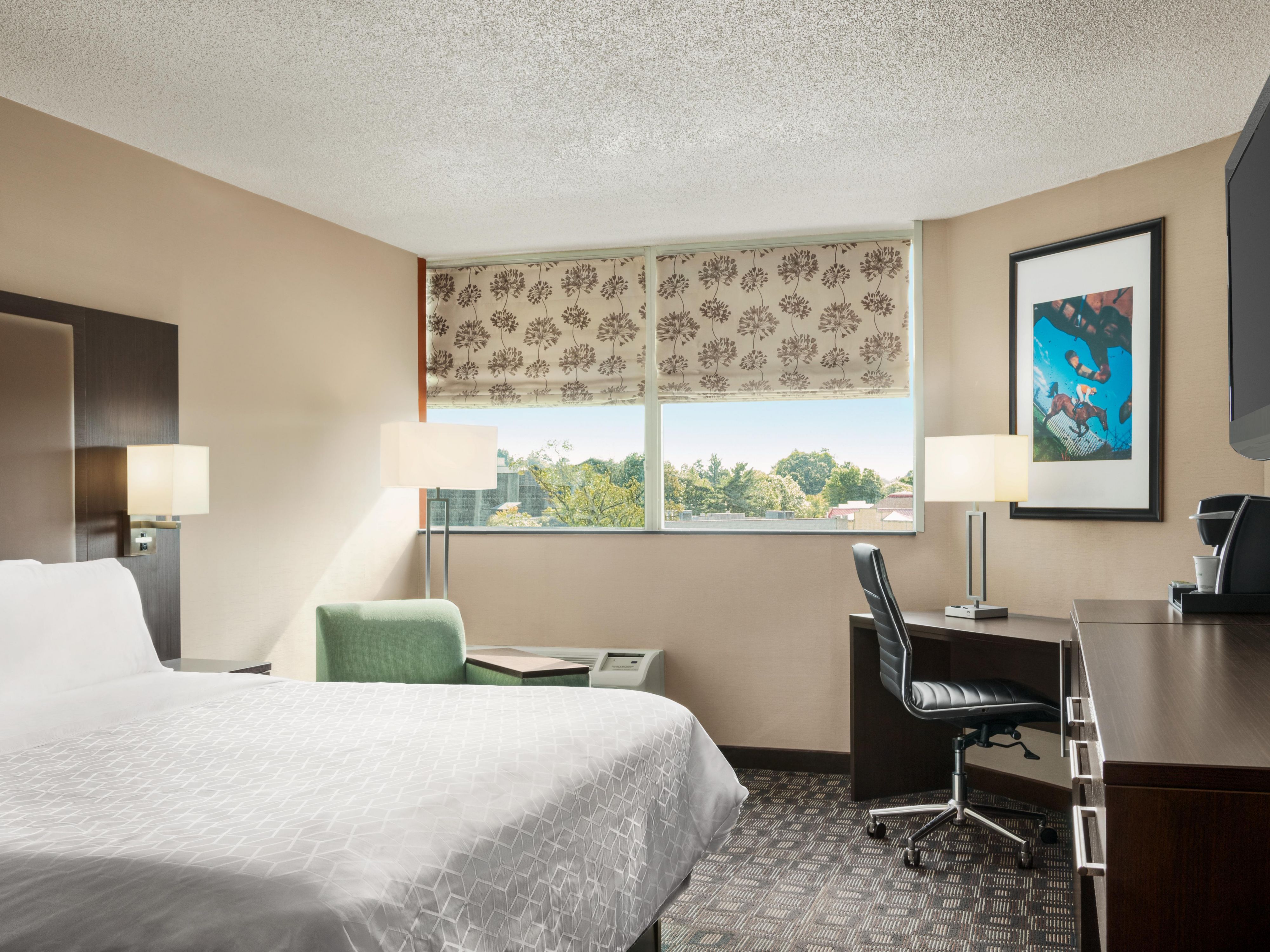 Stay productive in our spacious king guest room with a work desk.