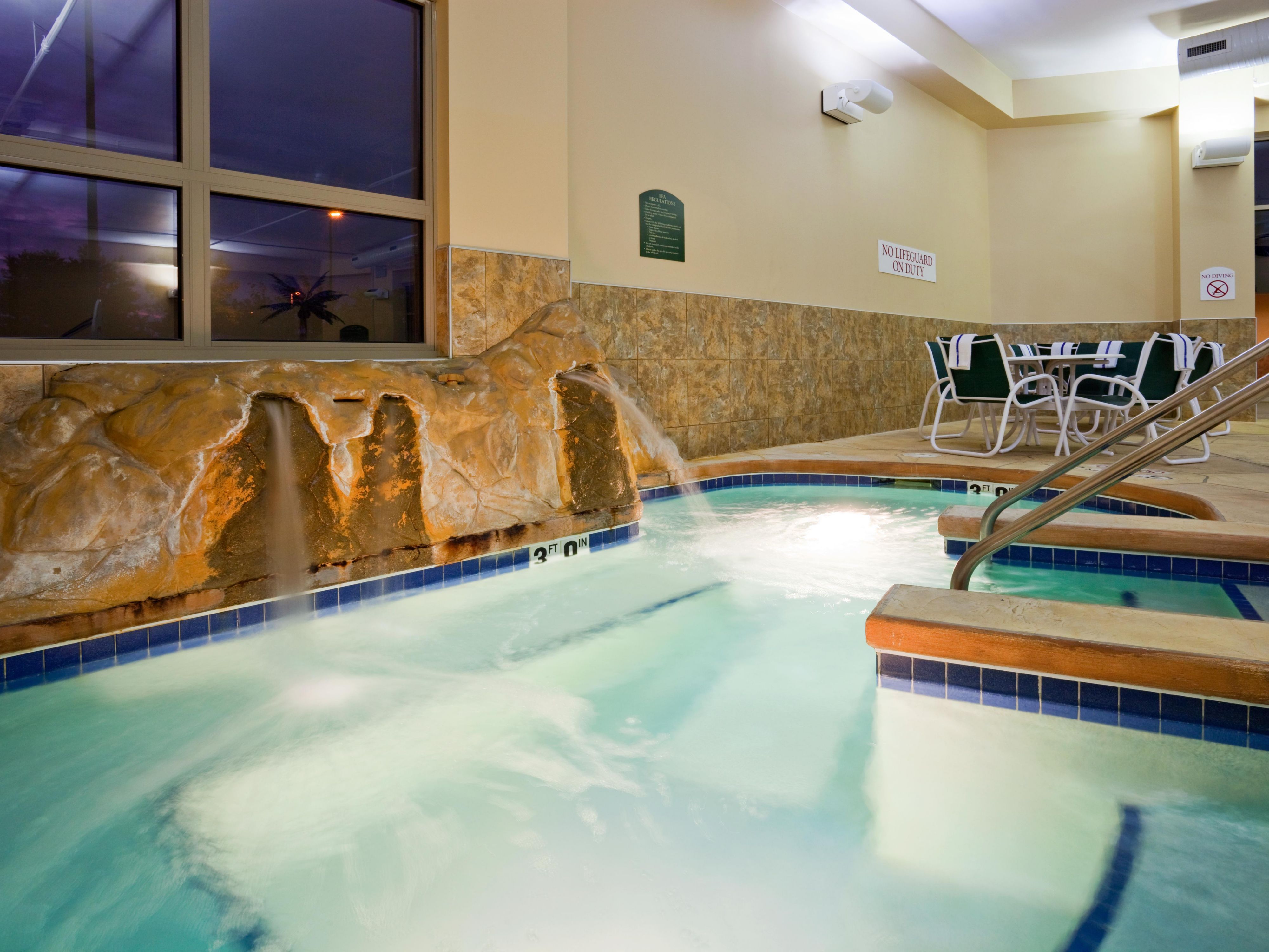 Have a relaxing day in our waterfall hot tub.