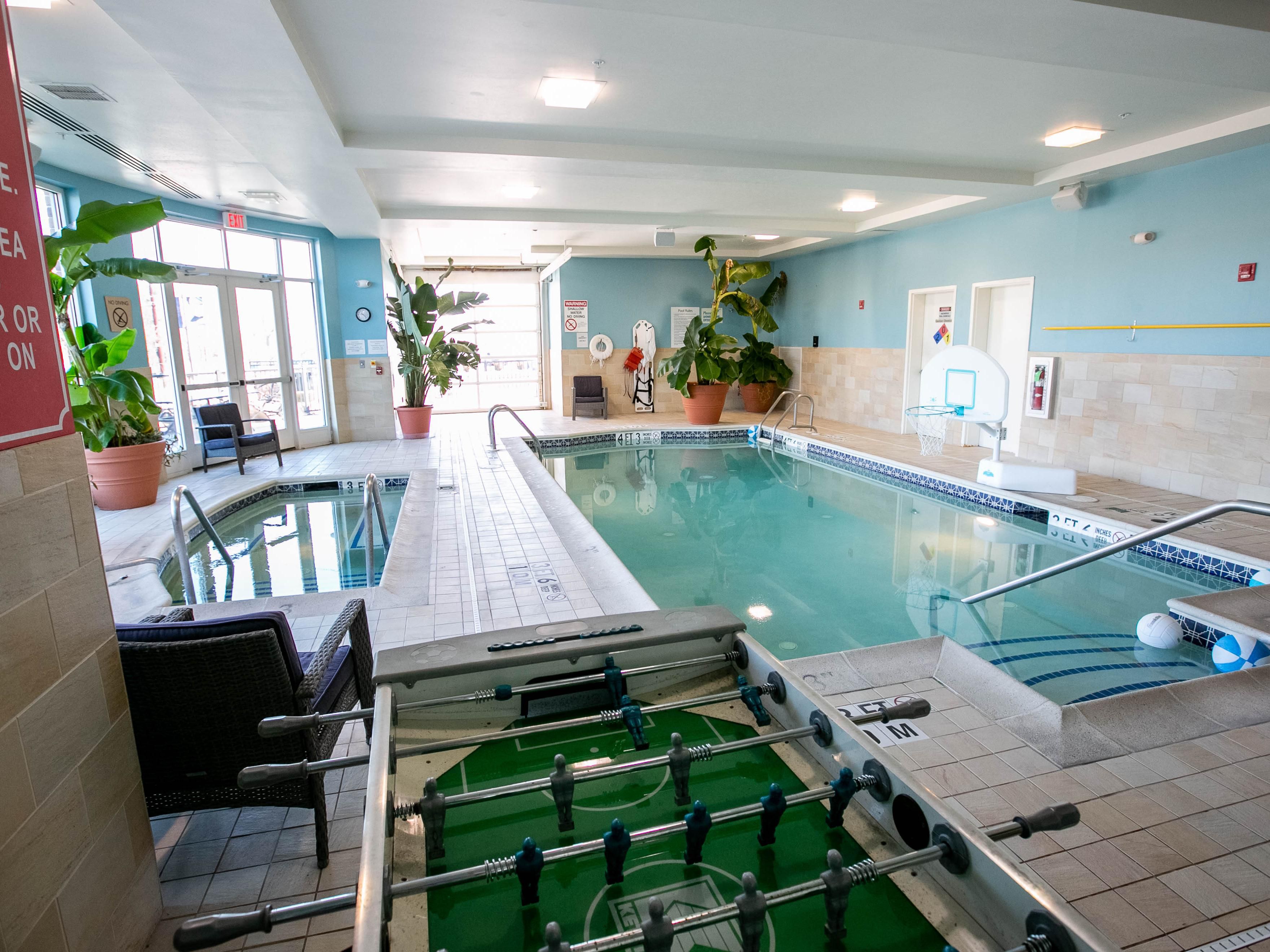 Indoor pool and hot tub on property
