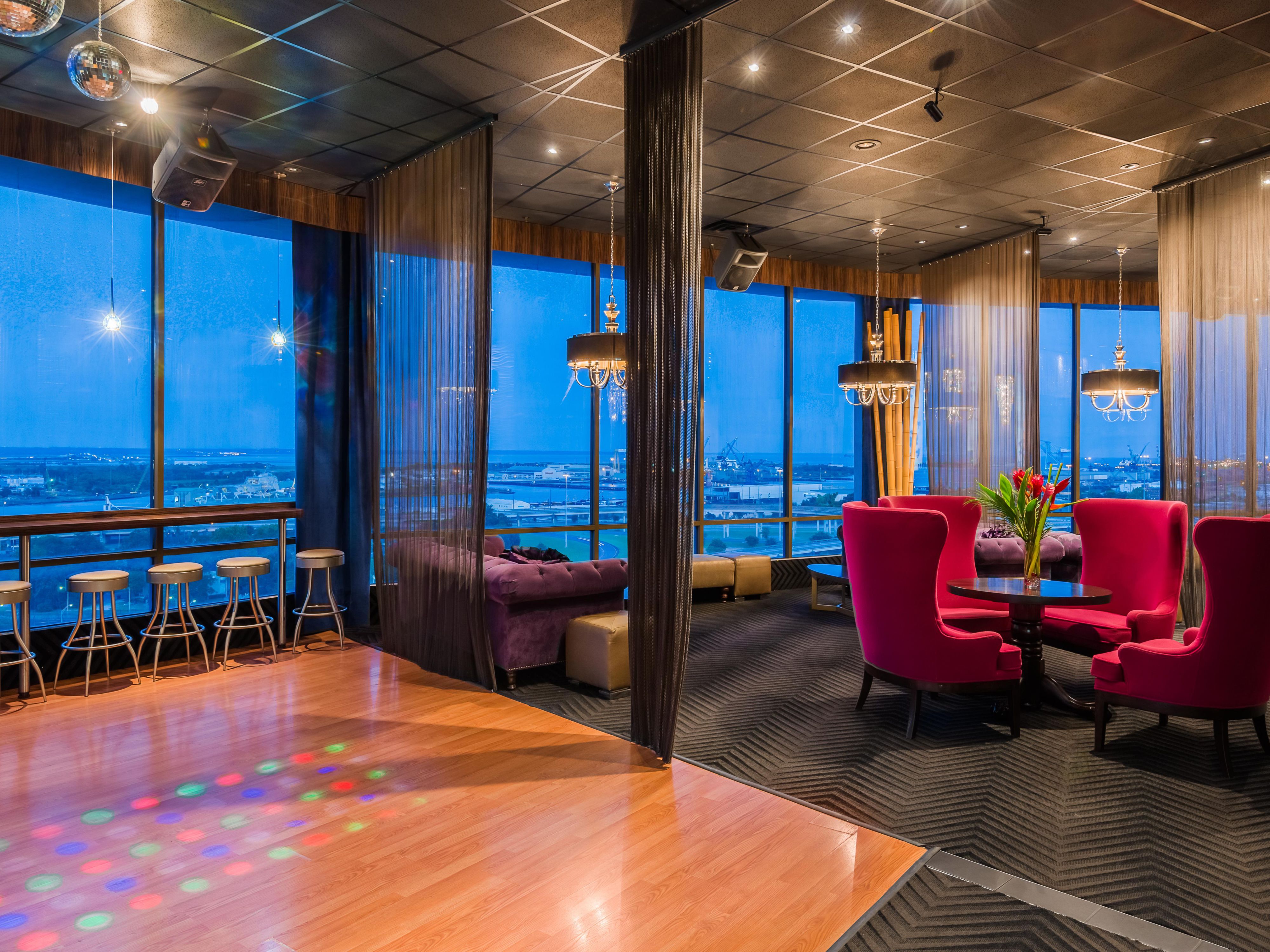Elevate your experience at our 17th floor SkyView Lounge, where breathtaking views meet exquisite drinks. Overlooking the bay and downtown Mobile's Government Street, this stylish bar offers a stunning backdrop for any occasion. Savor expertly crafted cocktails, delightful small plates, and panoramic vistas of the city skyline and the serene bay. 