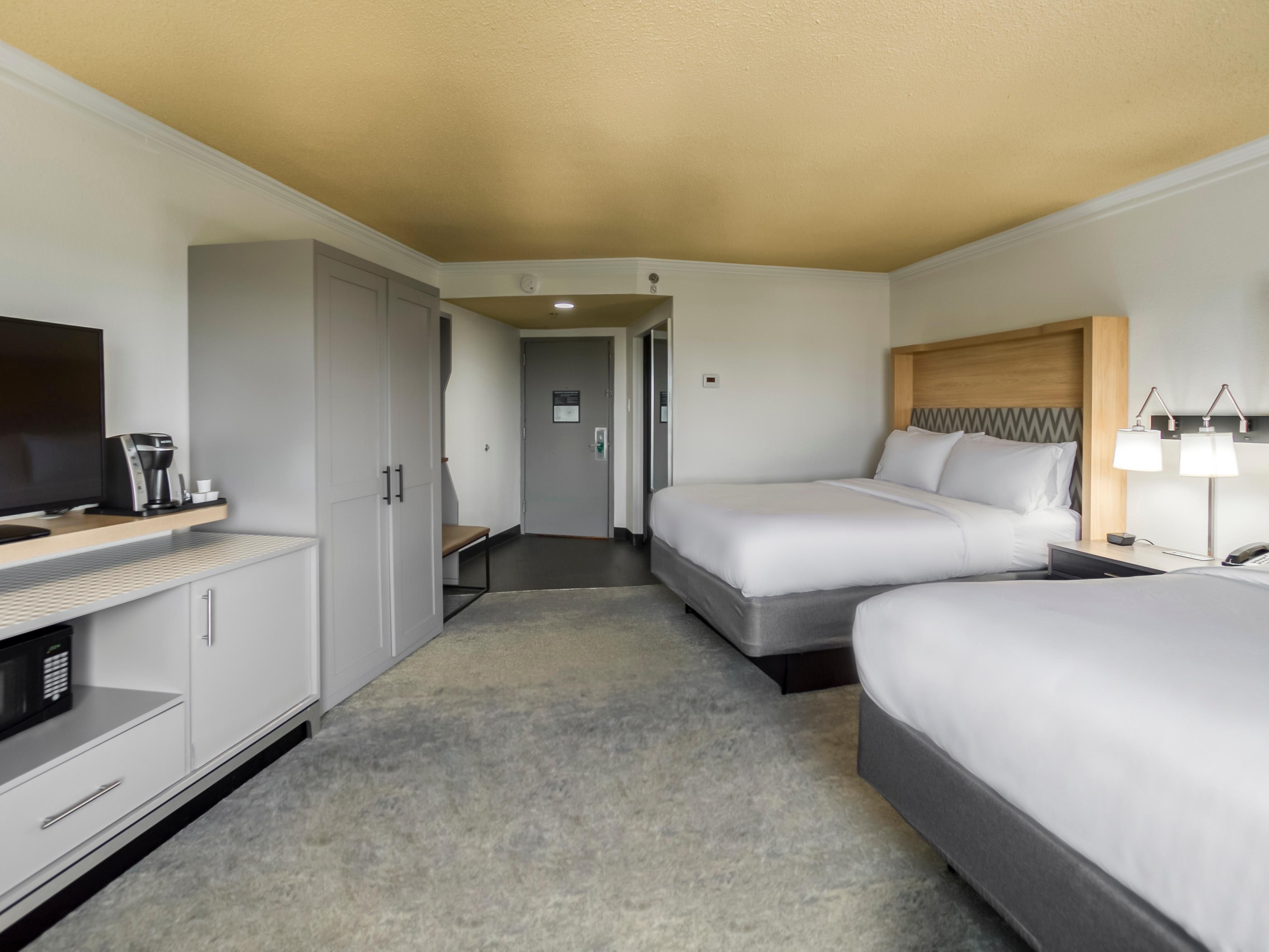 Experience the warmth of our queen bed guest room.