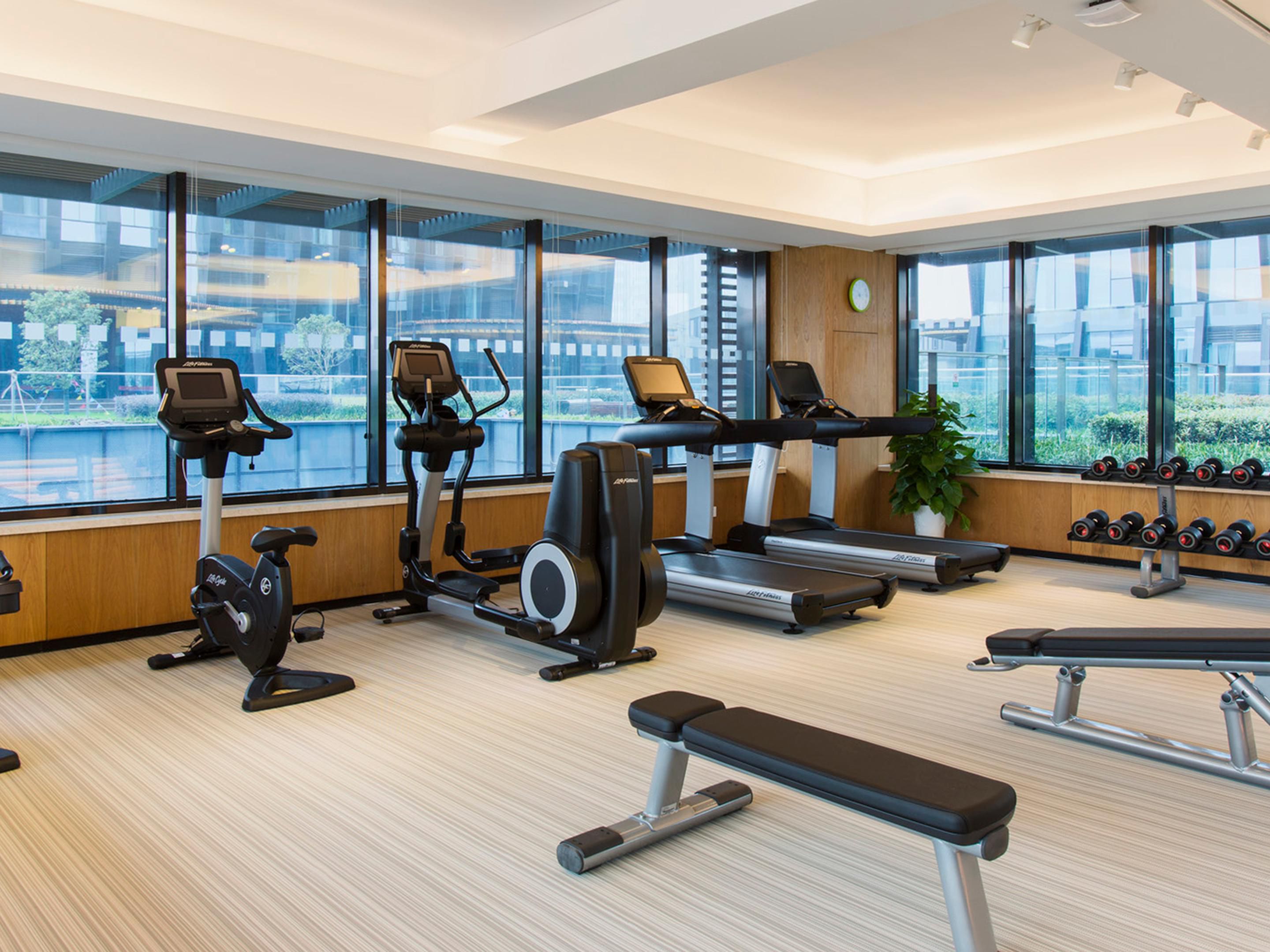 The gym is located at the 6th Floor, equipped with high-end fitness equipment and floor-to-ceiling windows, provide a comfortable and relaxing workout environment.
