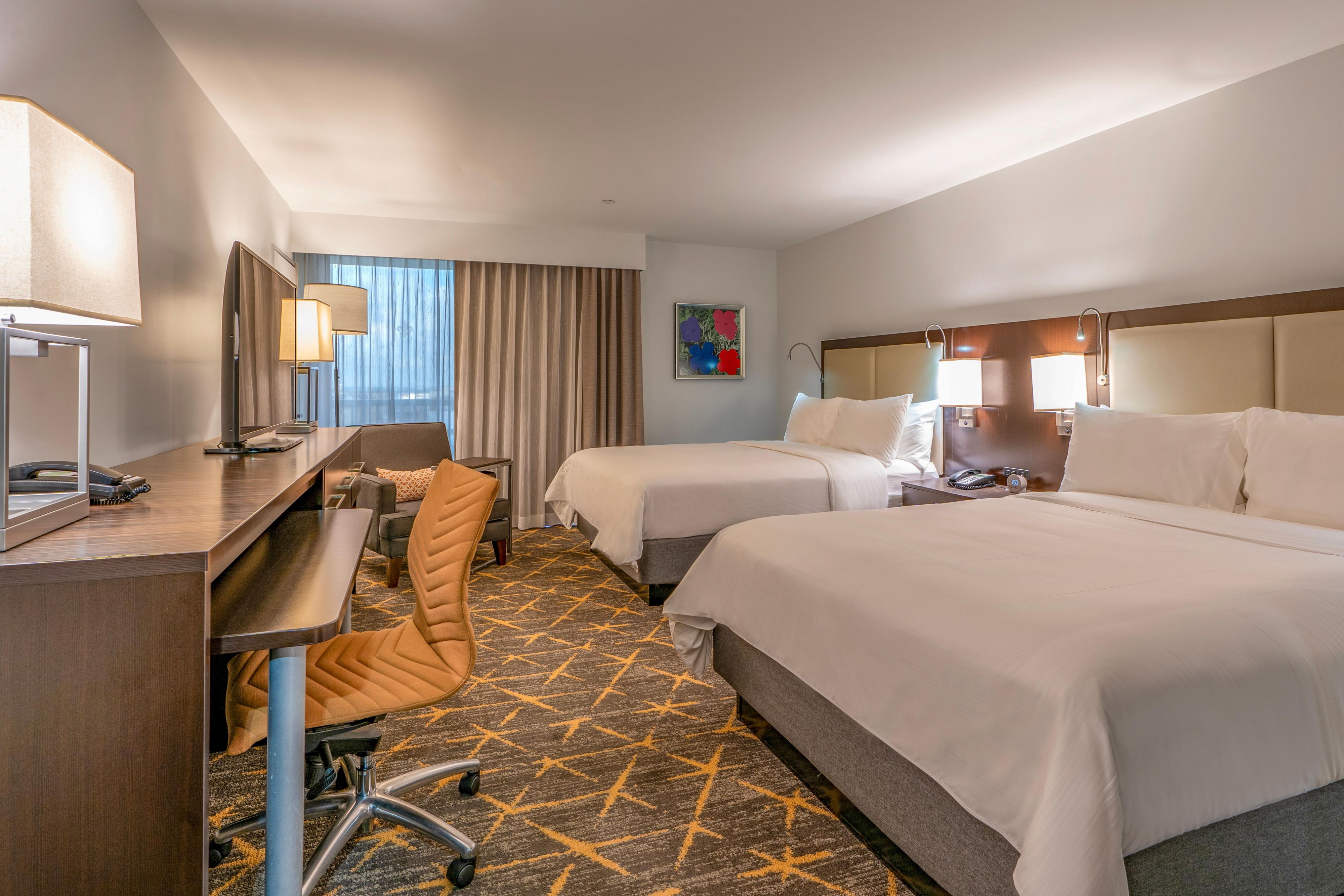 Stretch out and relax in our spacious two queen beds guest room.