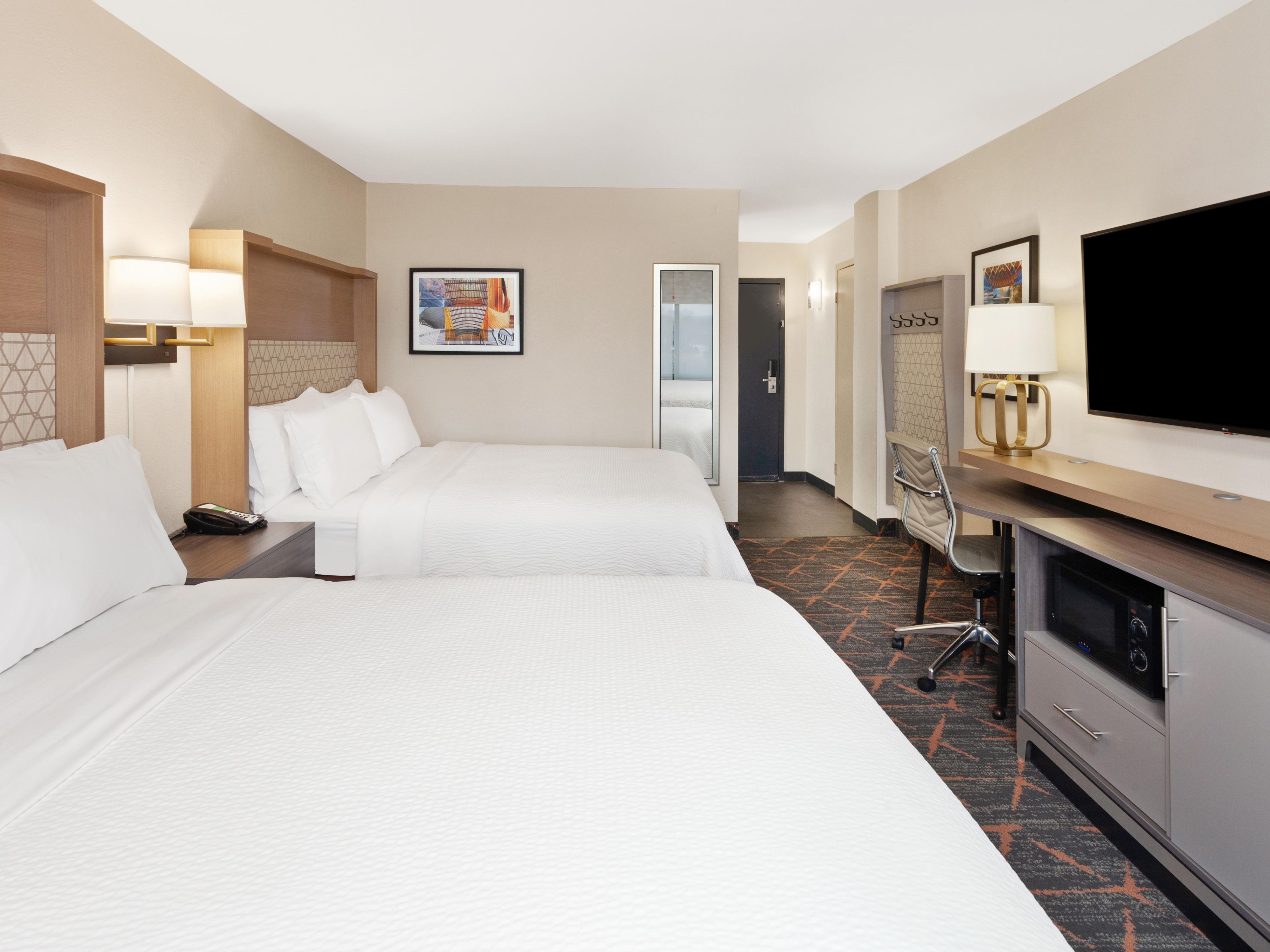 When you book a room here, you can expect the best in guestroom amenities like our relaxing plush, triple-sheeted beds, flatscreen TVs, free access to high-speed Wi-Fi Internet, workspaces with accompanying lamps, microwaves, controllable air conditioning, and bathrooms that provide complimentary Bath & Body Works shampoos and conditioners.