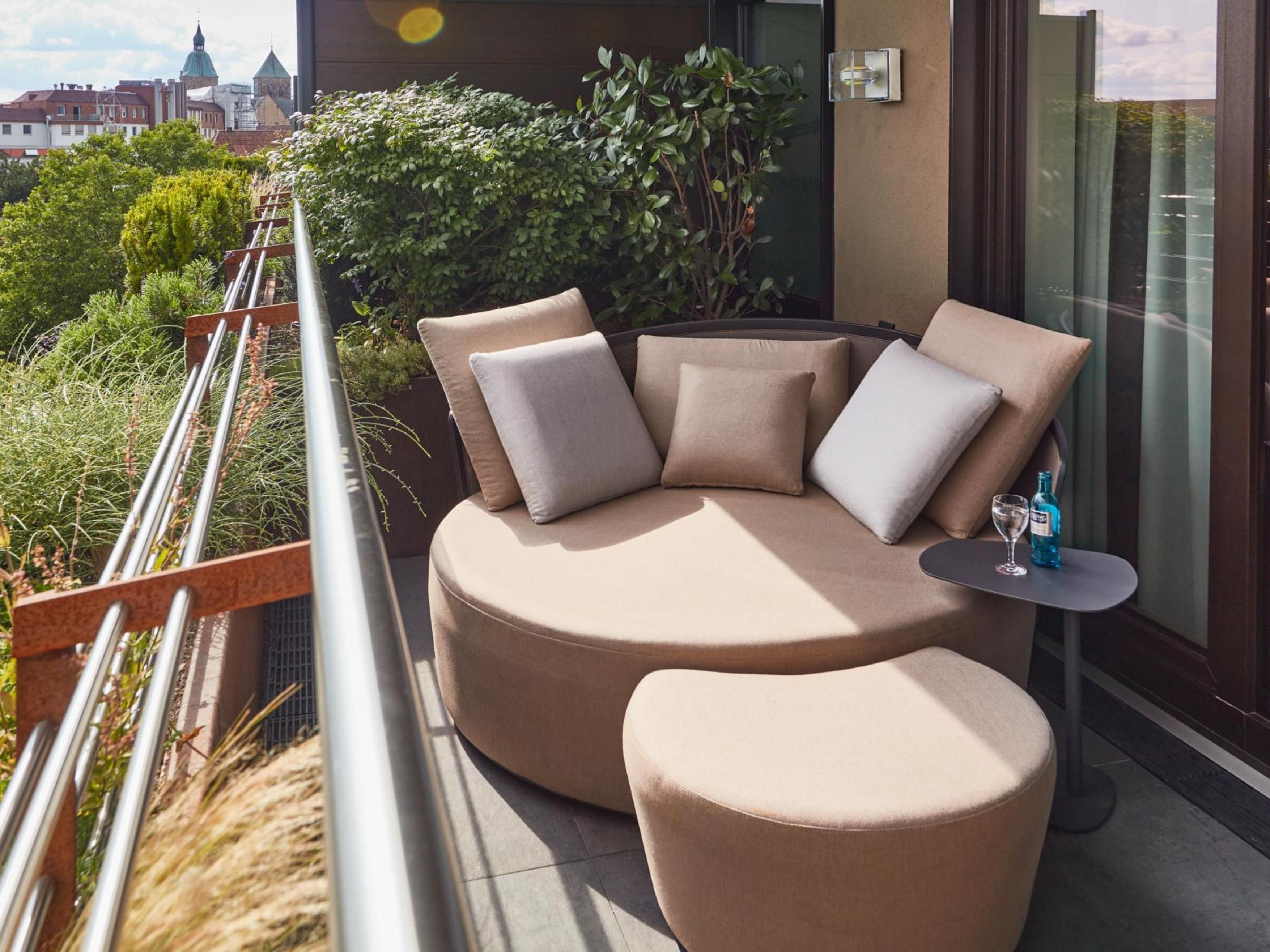 Relax and unwind in our rooms with balcony on the top floor overviewing the city of Osnabrück