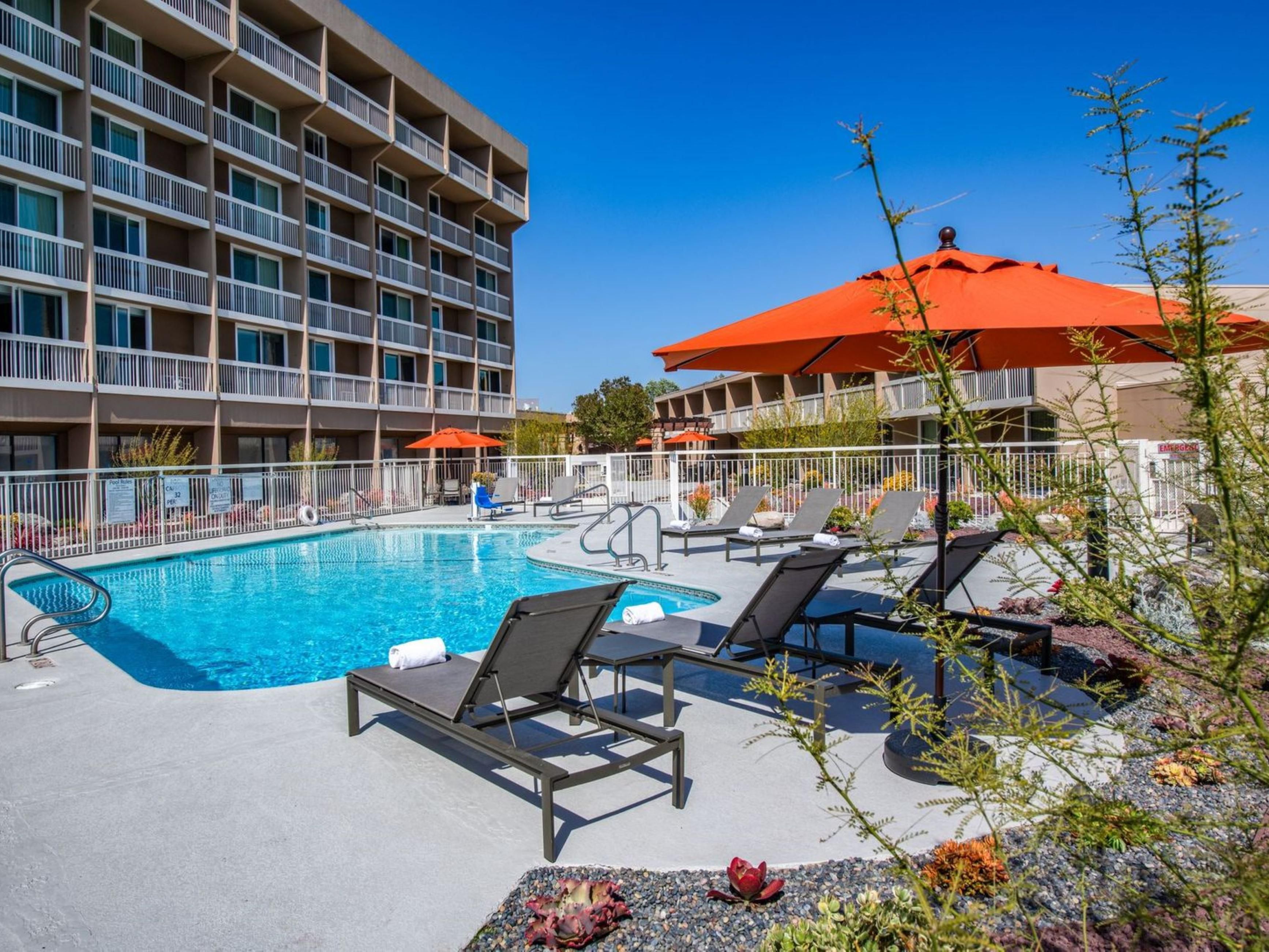 Whether you choose to unwind in the outdoor heated pool or the soothing whirlpool Jacuzzis, our spaces are designed to help you relax, recharge, and savor every moment. Plus, stay connected with complimentary Wi‑Fi, refresh in our 24‑hour fitness center, or grab a bite at the onsite restaurant & bar - all crafted for your comfort and enjoyment.