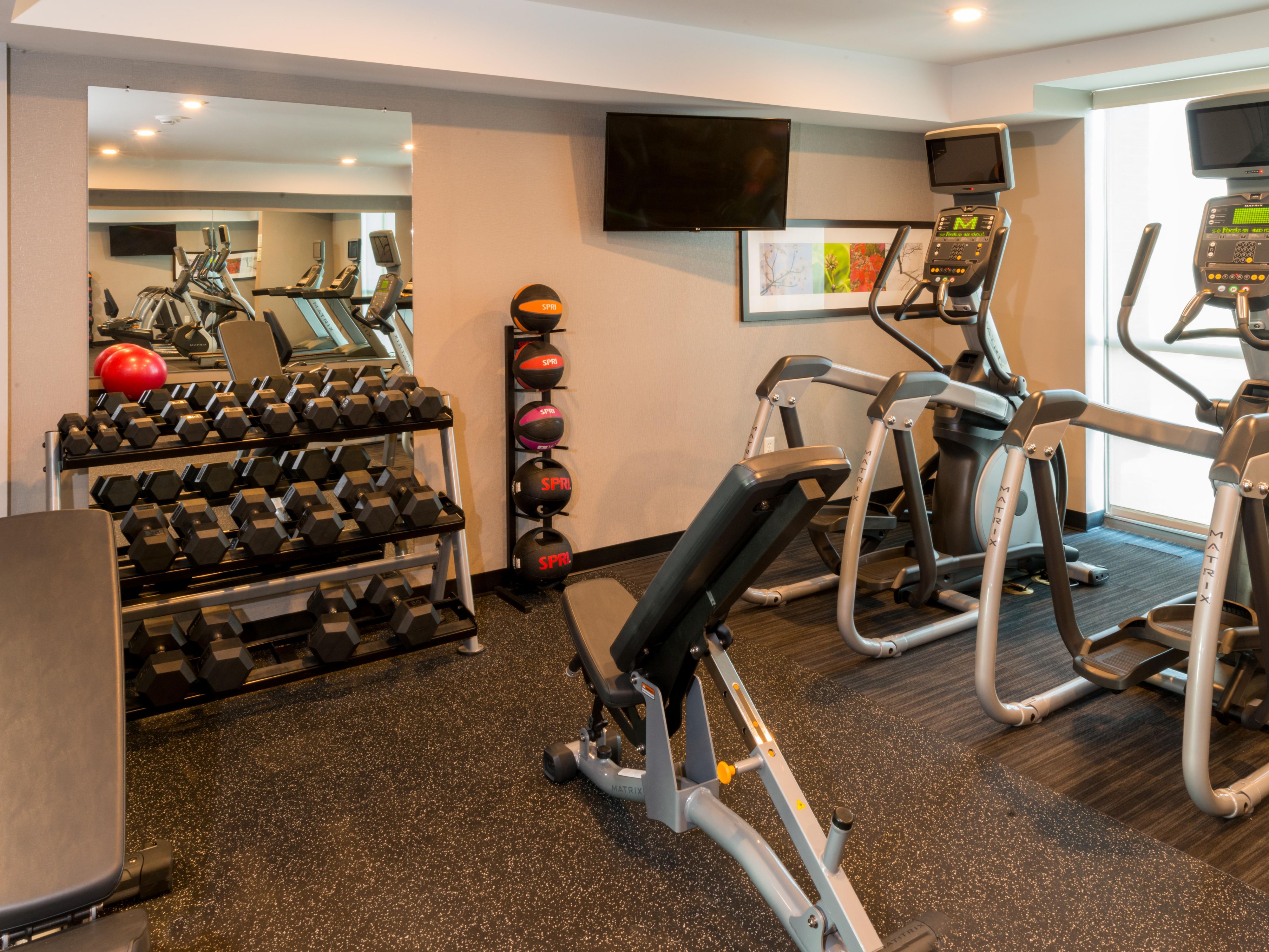 Modern Fitness Room with Extensive Options.