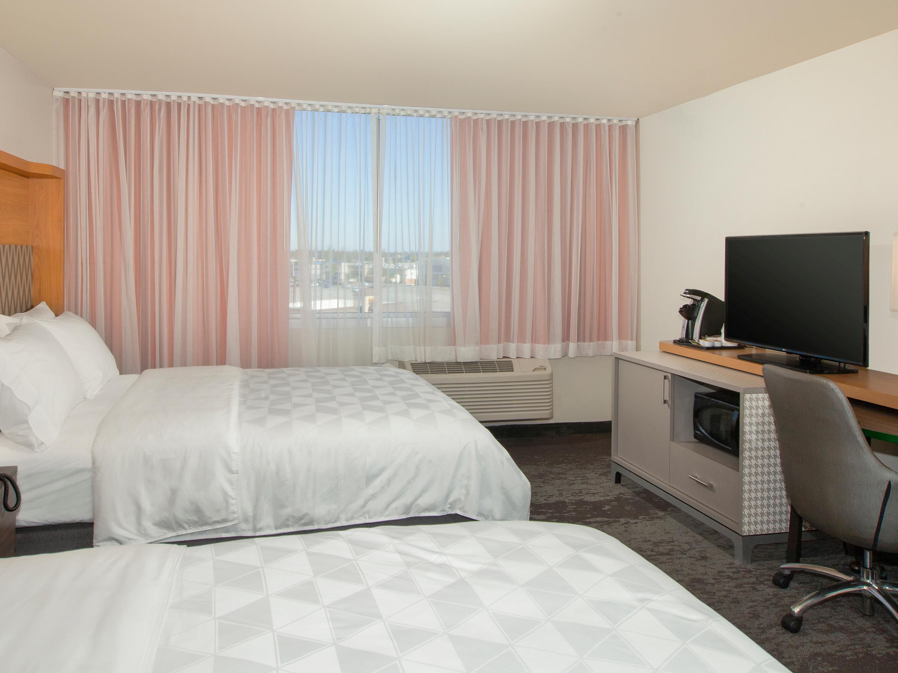 Book a room with two queen beds for friends & family.