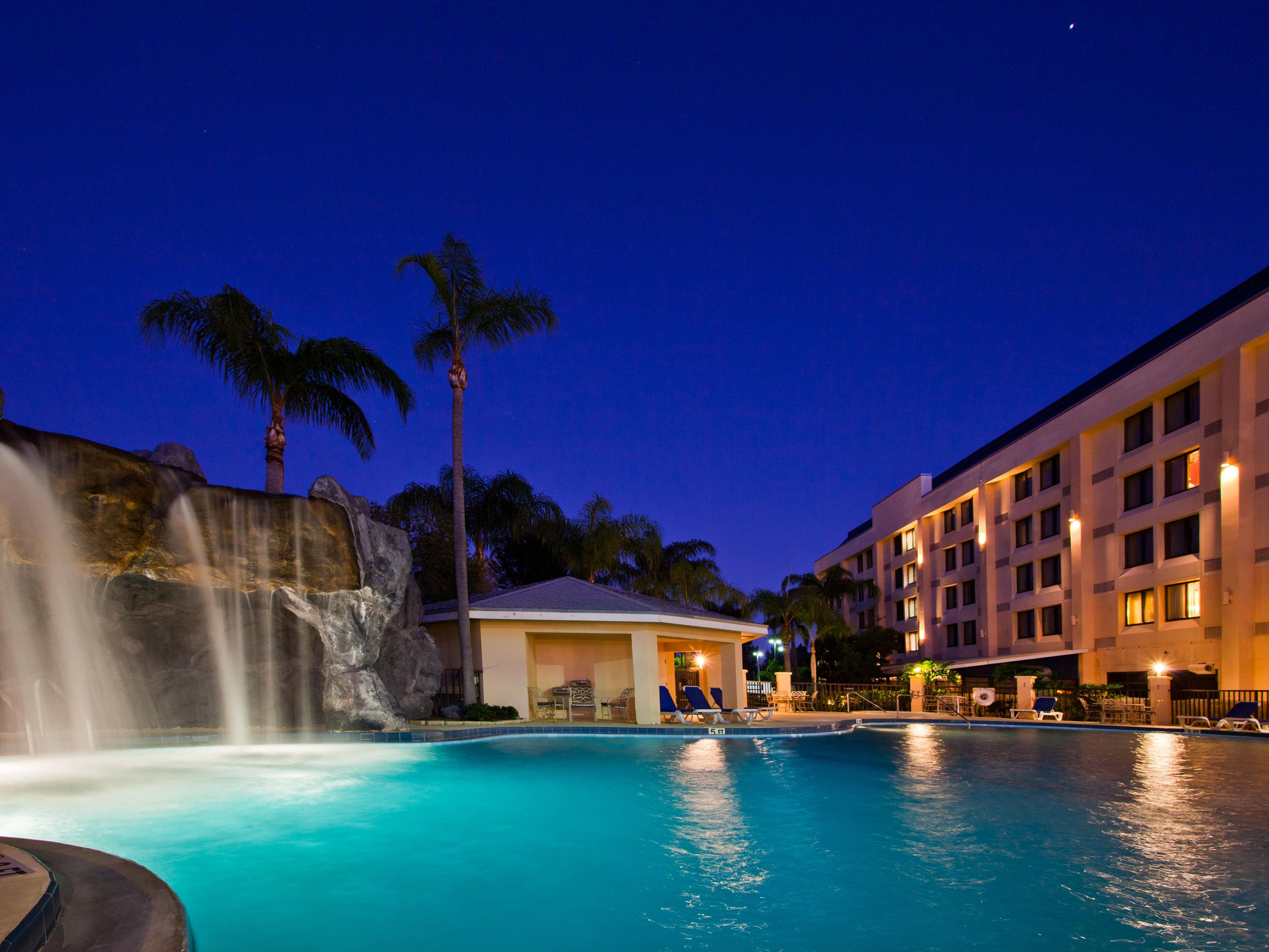 Unwind beside our pool while listening to the waterfall. 