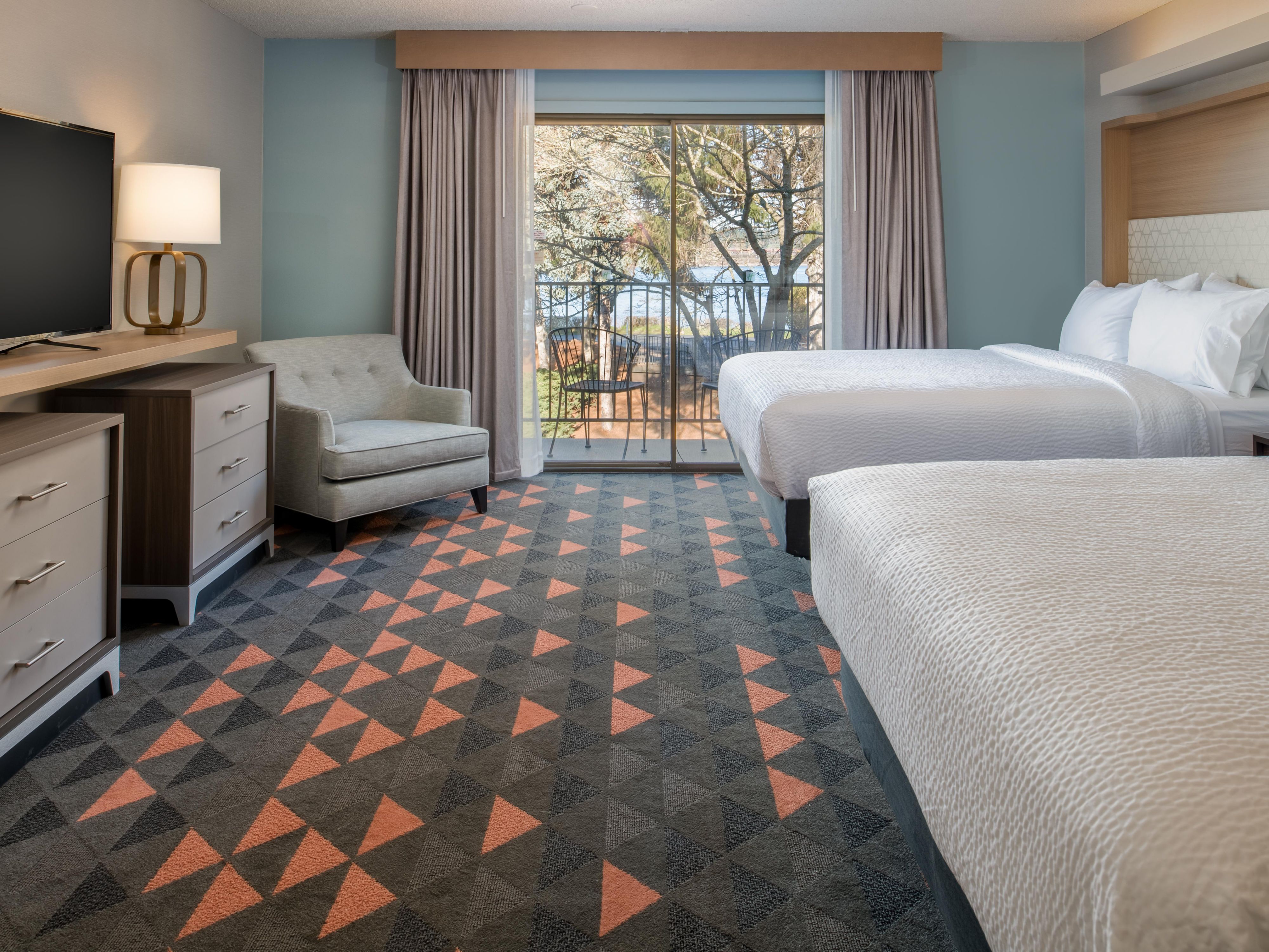 Relax in our newly updated guest rooms and suites with private balconies giving you a front-row seat to the beauty of the Pacific Northwest. Enjoy beautiful river views and modern amenities, including free Wi-Fi, a fridge, a microwave, Keurig coffeemaker, HDTV, and productive workspace.