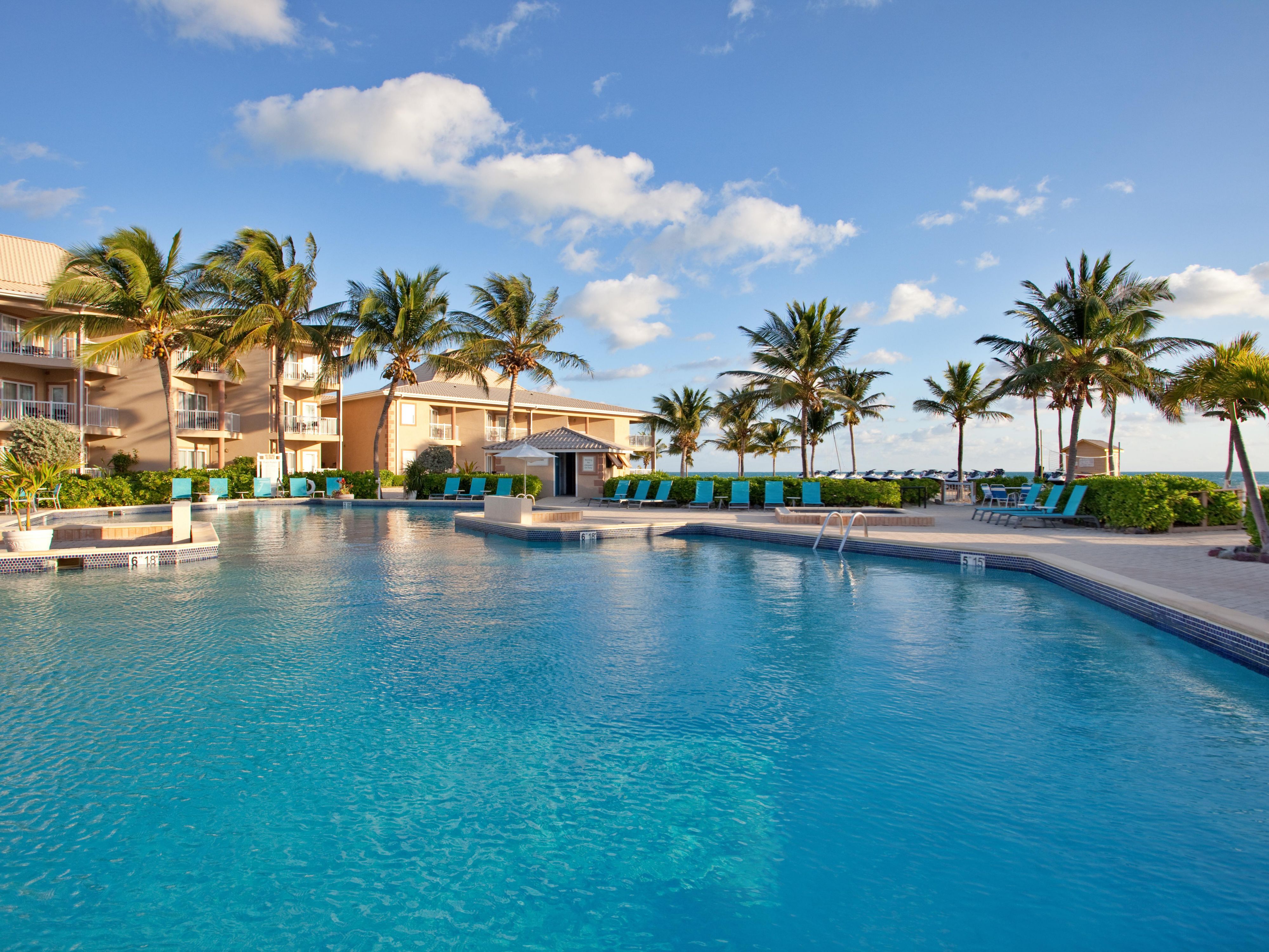 Dive into relaxation at our outdoor pool! Surrounded by lush landscaping and just steps from Driftwood Bar & Grill, it's the perfect spot to unwind, soak up the sun, or enjoy a refreshing swim. With comfortable loungers and scenic views, our pool area offers an ideal escape for all ages.