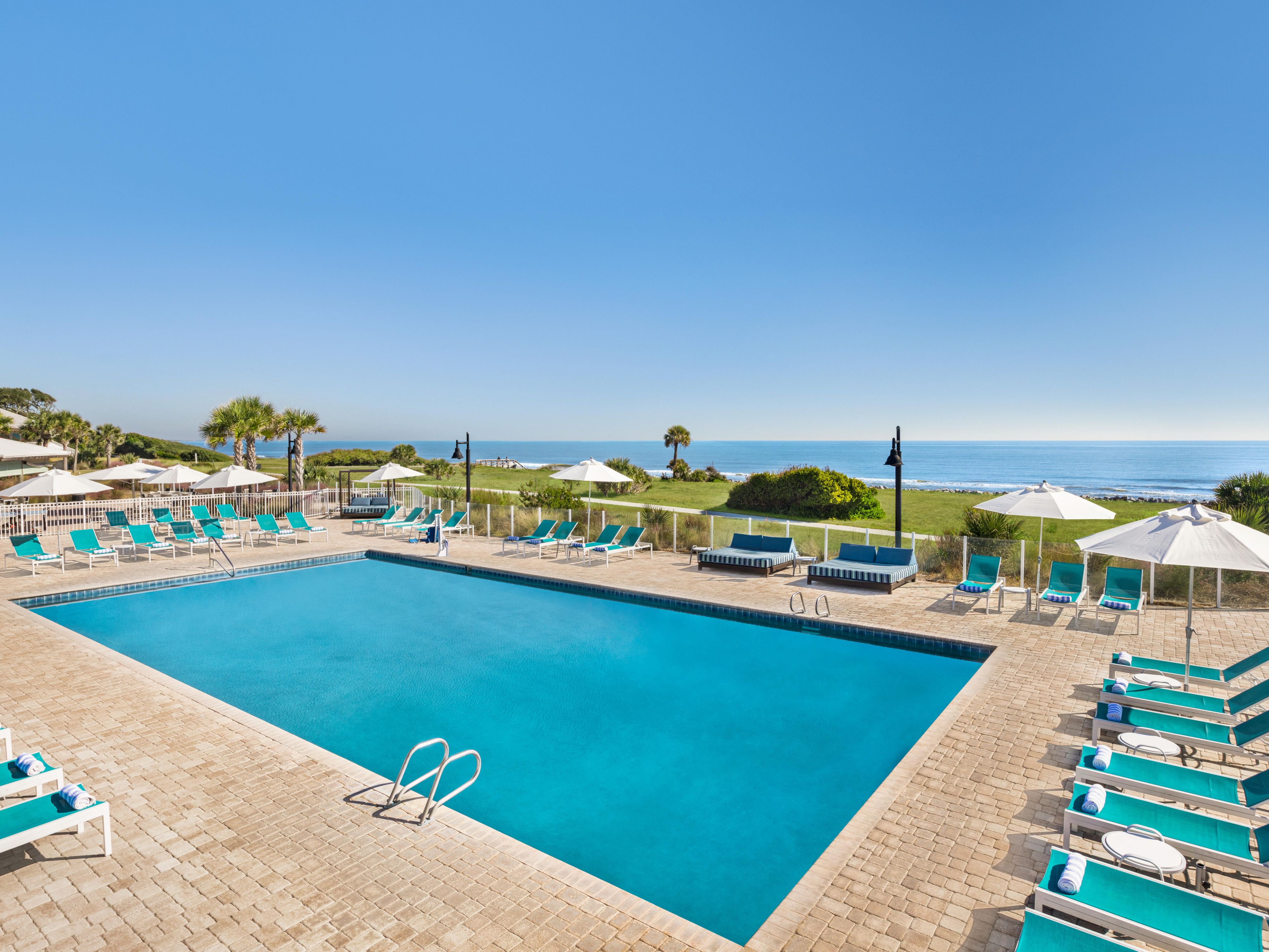 Dive into relaxation at our oceanfront pool, featuring stunning views and a refreshing escape from the heat. Lounge on the sun deck, sip on a cool drink from the poolside bar, and soak in the picturesque scenery. Our pool is a serene haven where water meets the sky.