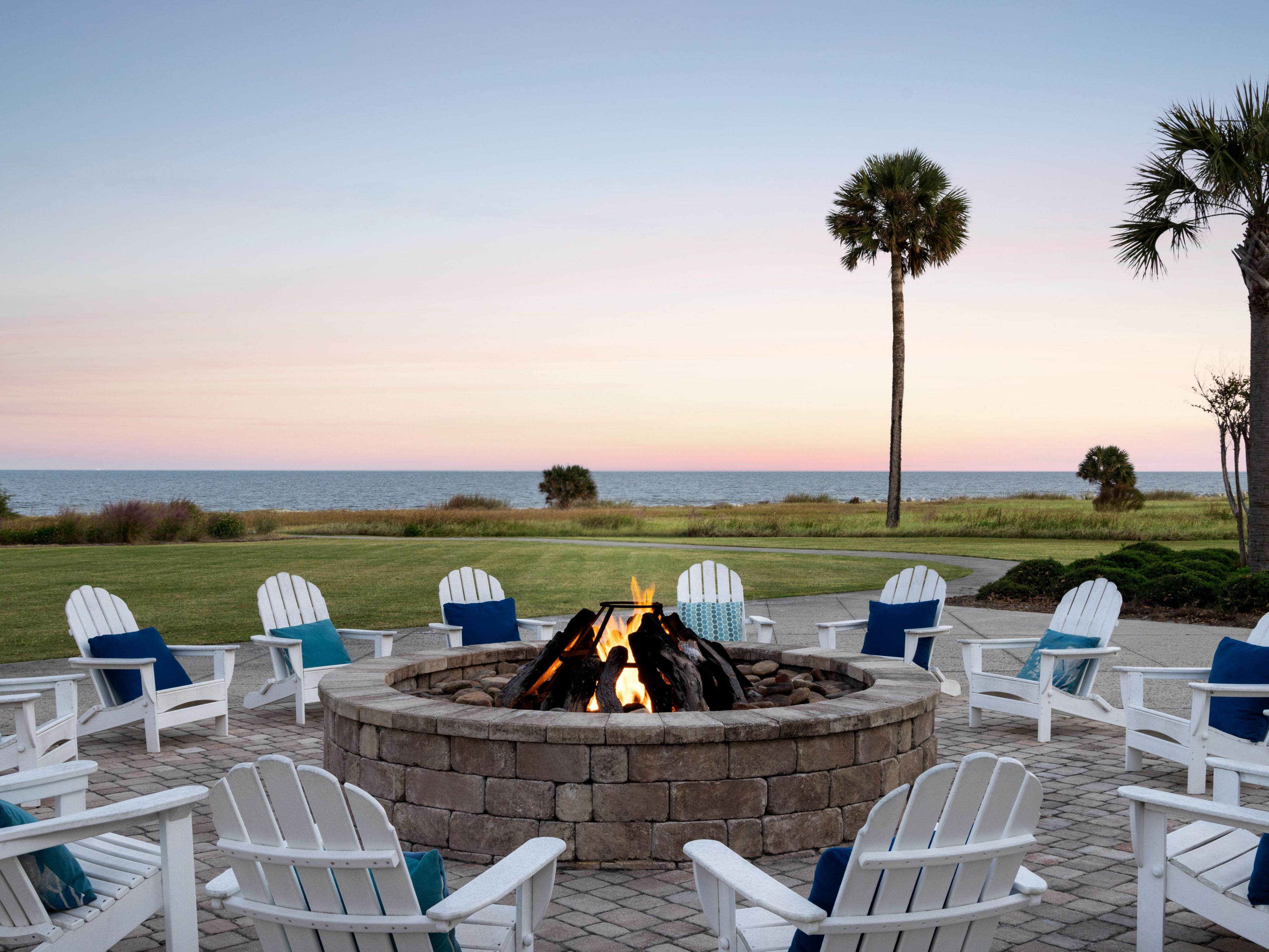 Beach chairs around a fire pit