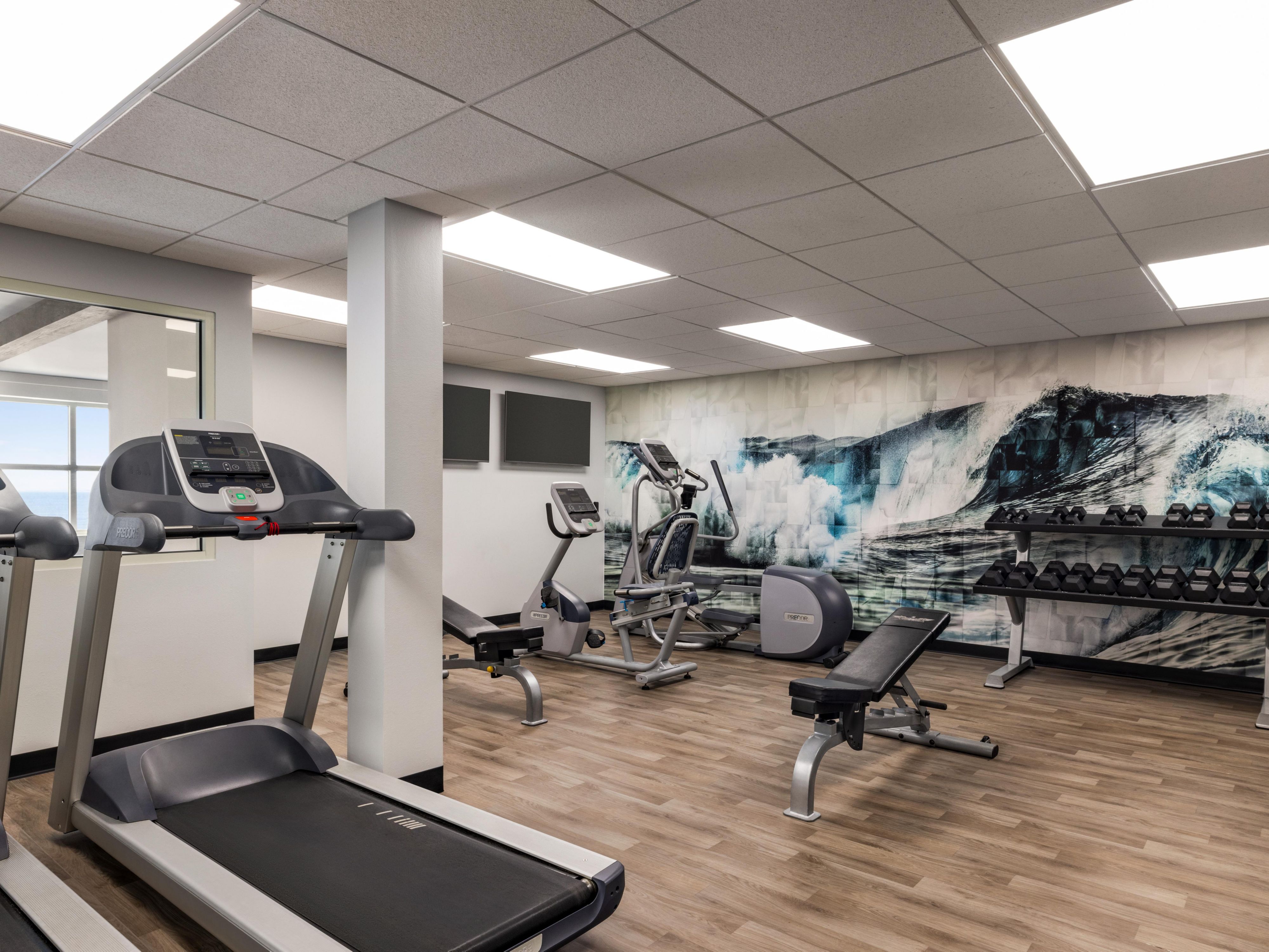 Elevate your workout at our ocean view fitness center, featuring the latest training equipment. Enjoy a range of modern machines, including ellipticals, free weights, stationary bikes, and treadmills. Our premier facility is designed to help you achieve your fitness goals with views of the Atlantic in the distance.