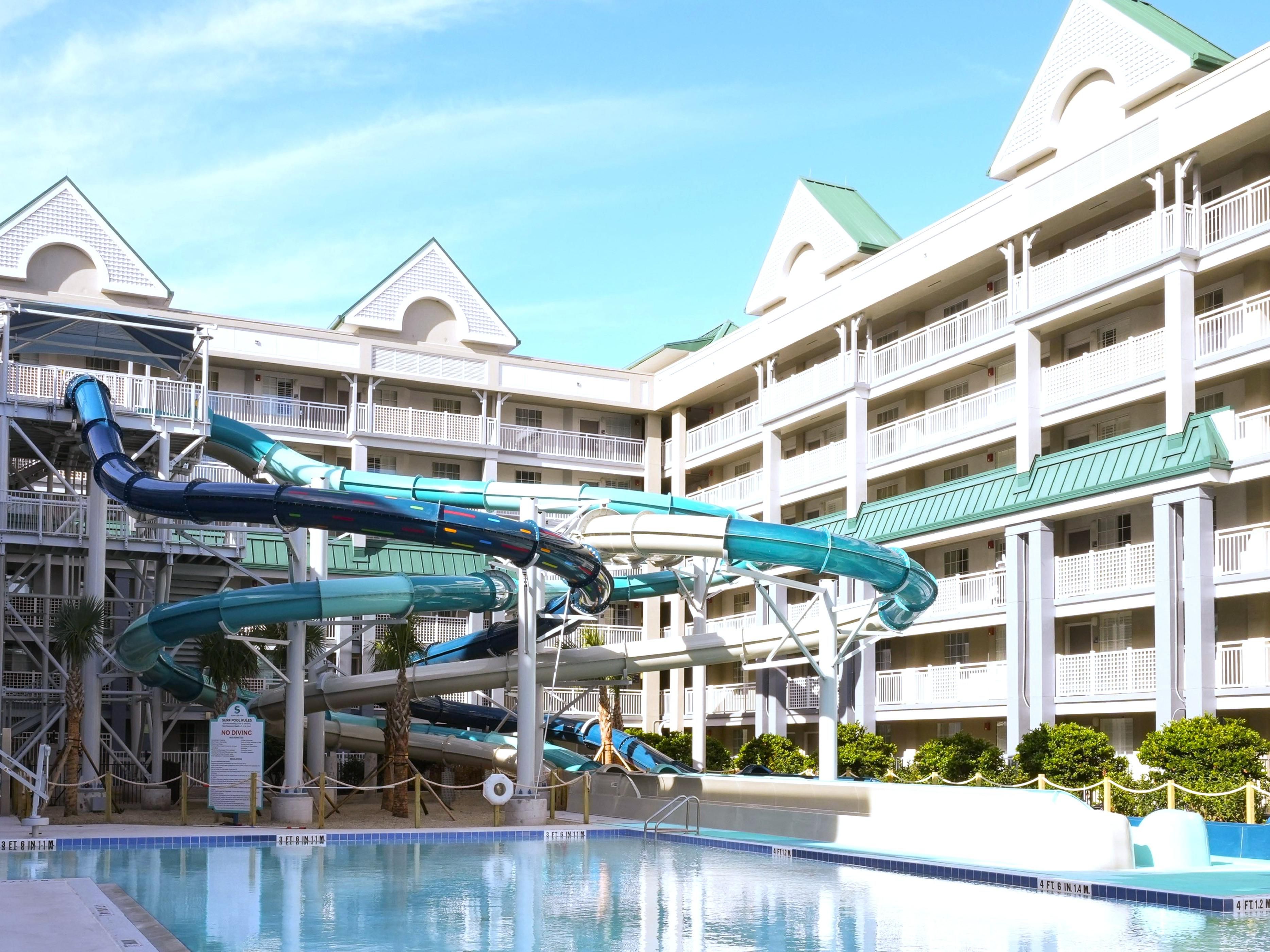 Three water slides from the top of the hotel