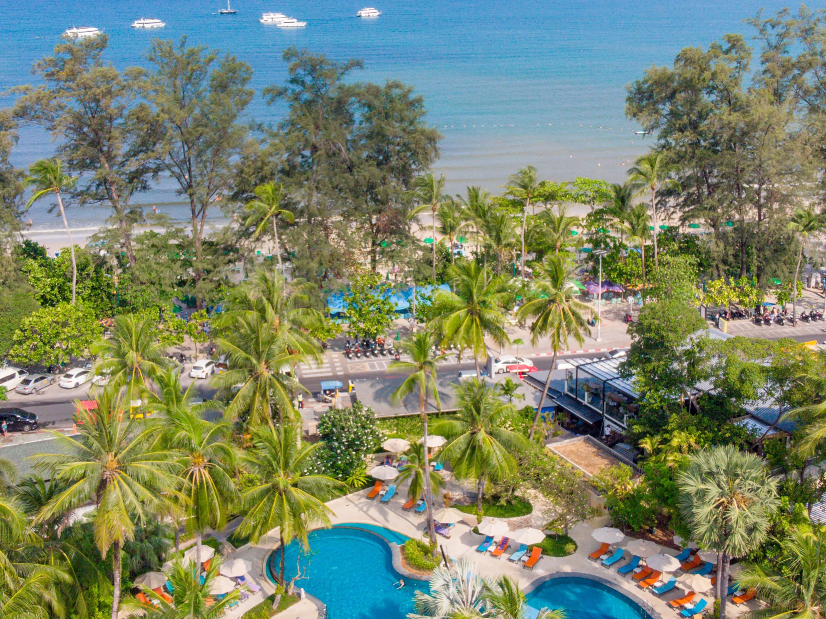 Across from the renowned Patong Beach, our resort is a serene escape for travellers seeking both relaxation and adventure. Enjoy lush surroundings, sun-drenched shores, and beachside activities. Explore cultural treasures, and markets, and explore the vibrant shopping scenes at Juceylon and Central Patong Shopping Center.