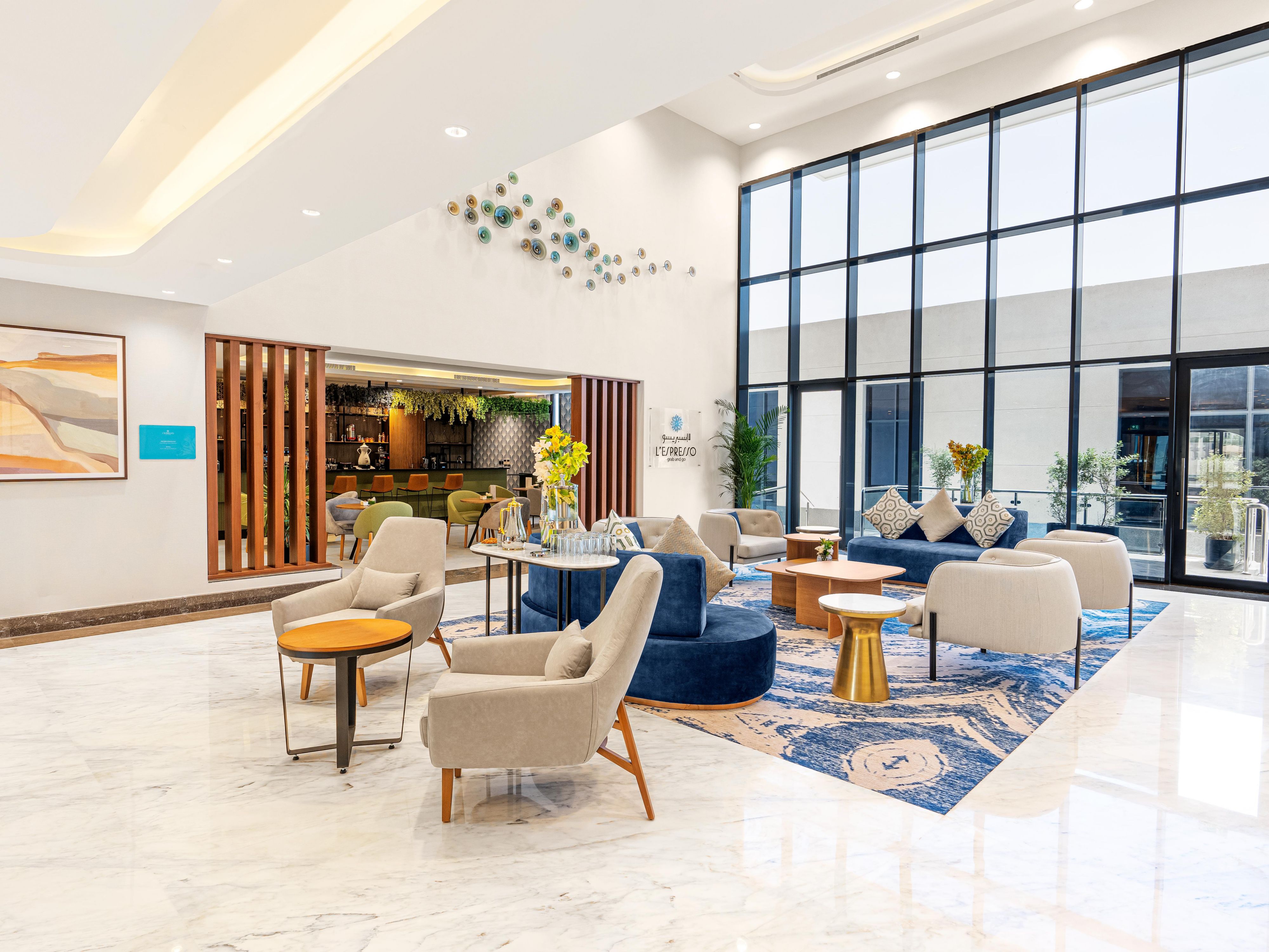 The open Lobby concept is an innovative design that integrates all public spaces into one cohesive open area! Unlike traditional lobbies, we wanted to offer our guests an entirely new way to provide a comfortable and welcoming space where guests can feel home and enjoy their stay on their own, whether they want to eat, drink, work or socialize.