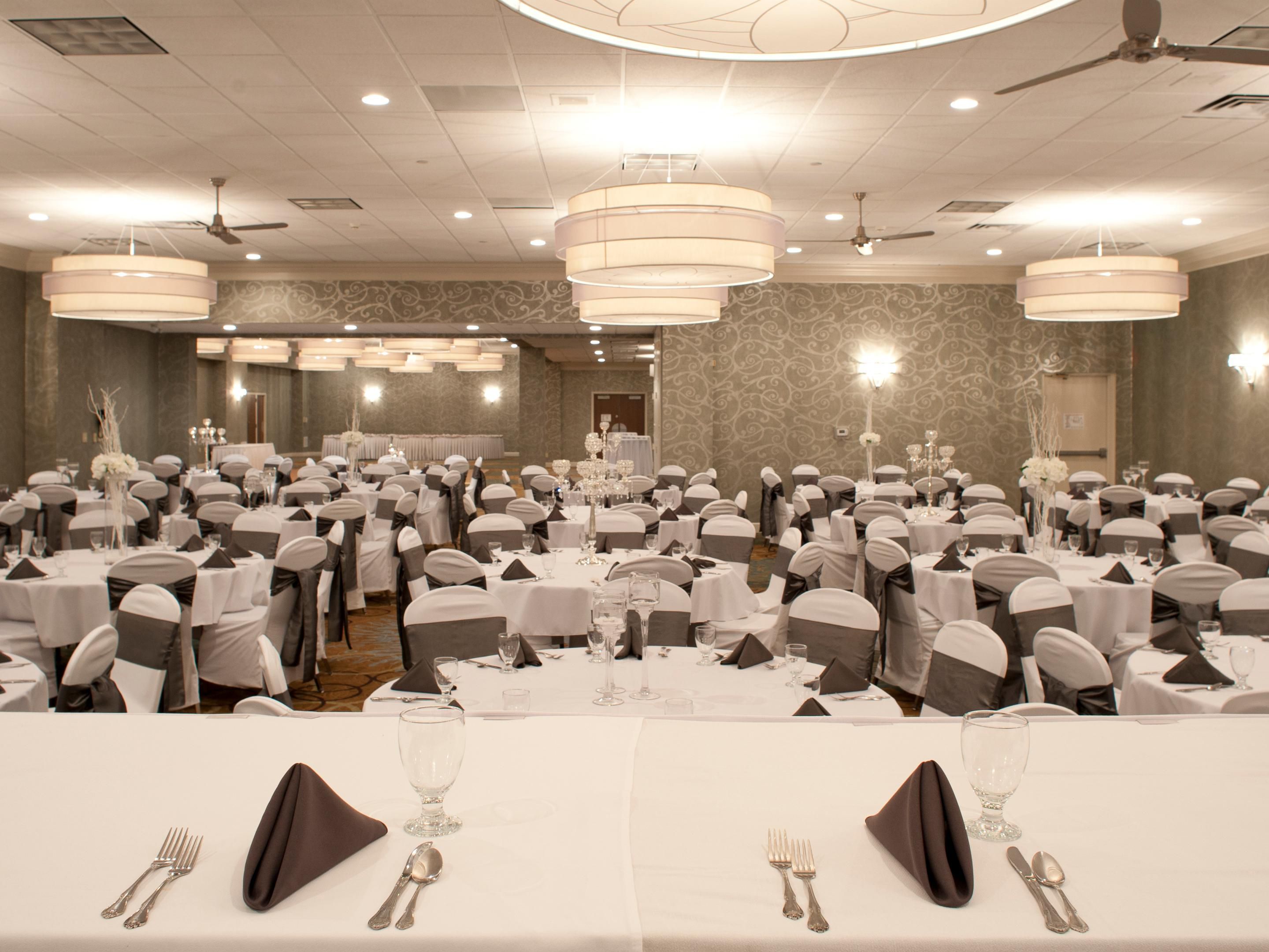 With 8 meeting rooms and 10,000 sq. ft. of event space, we can seat up to 500 guests for a wedding or 400 guests for a classroom style meeting. Our event space can be beautifully transformed to meet the needs of your style and budget. Contact our professional event planners at 309-948-5693 for a free custom quote today!