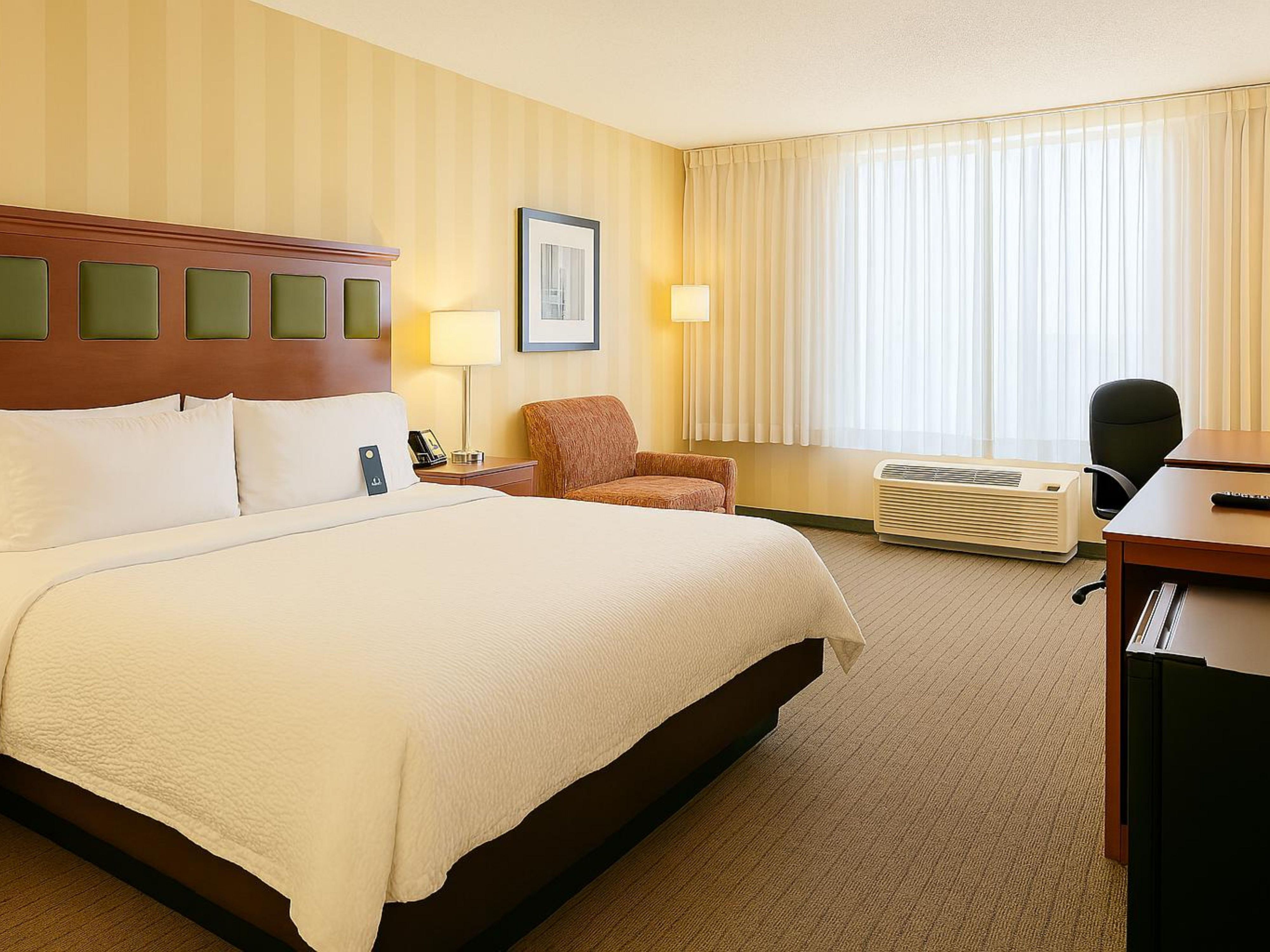 Relax and recharge in our bright, spacious King Guest Room.