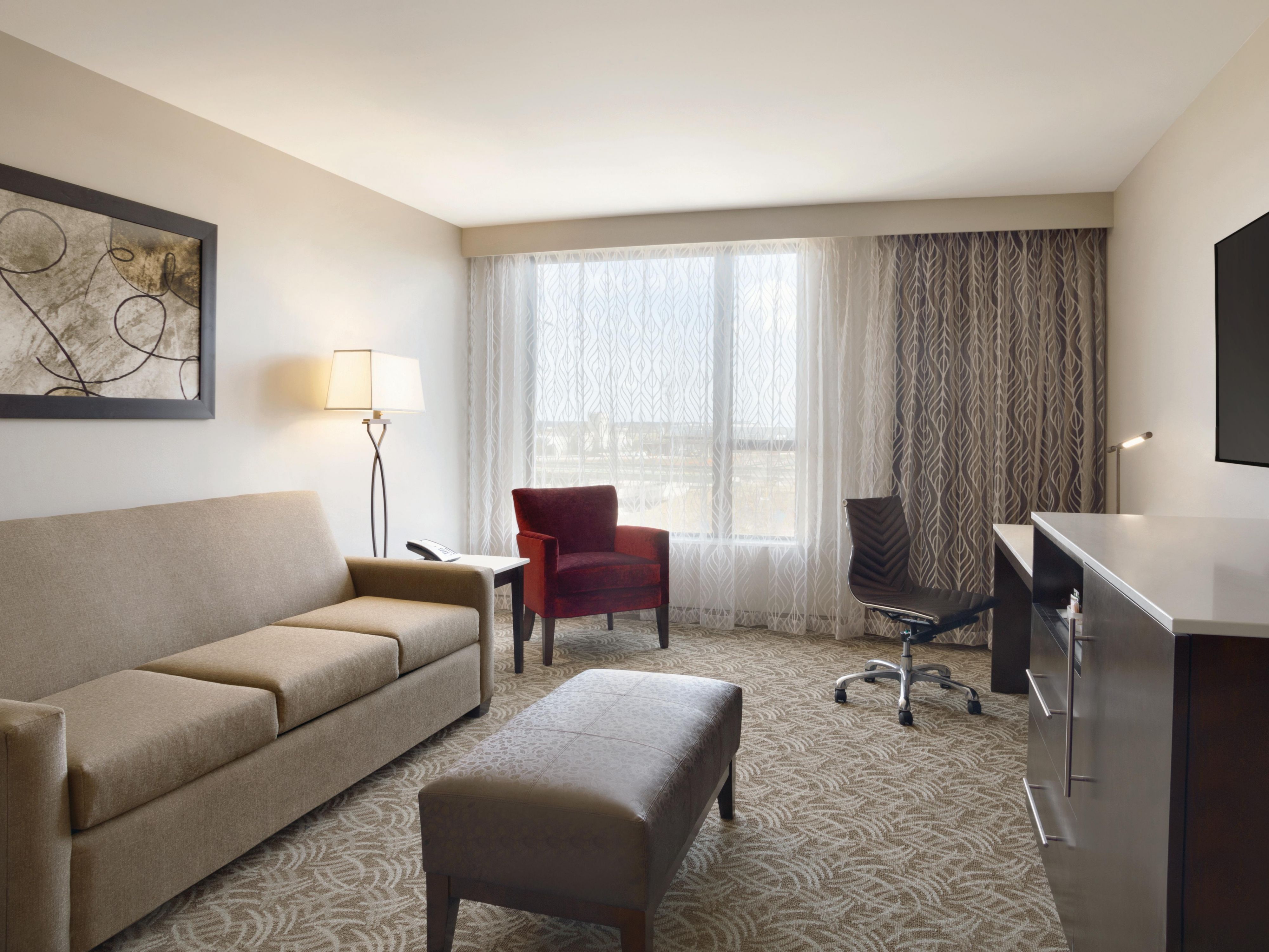 Contemporary design, plush bedding, and all the comforts travelers expect. Spacious design with either one king or 2 queen beds and amenities like a mini refrigerator, a Keurig coffee maker and supplies, a work area and a 42-inch TV.