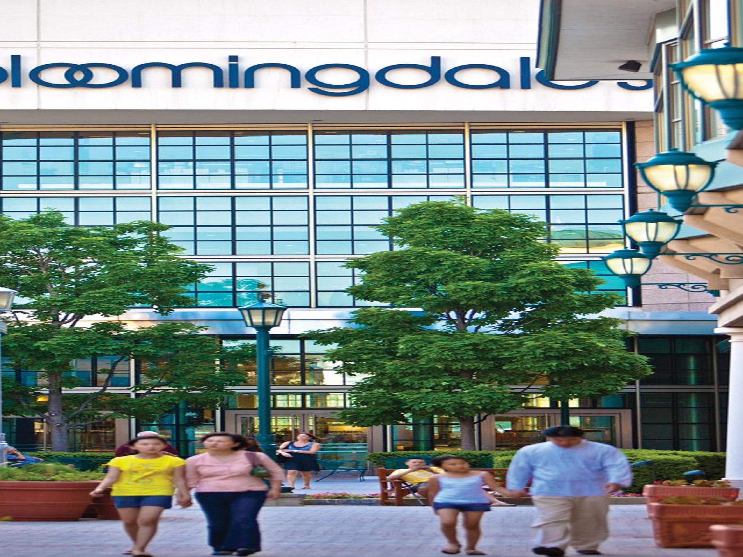 Upscale outdoor shopping mall with department stores, brand-name fashion retailers & chain eateries.