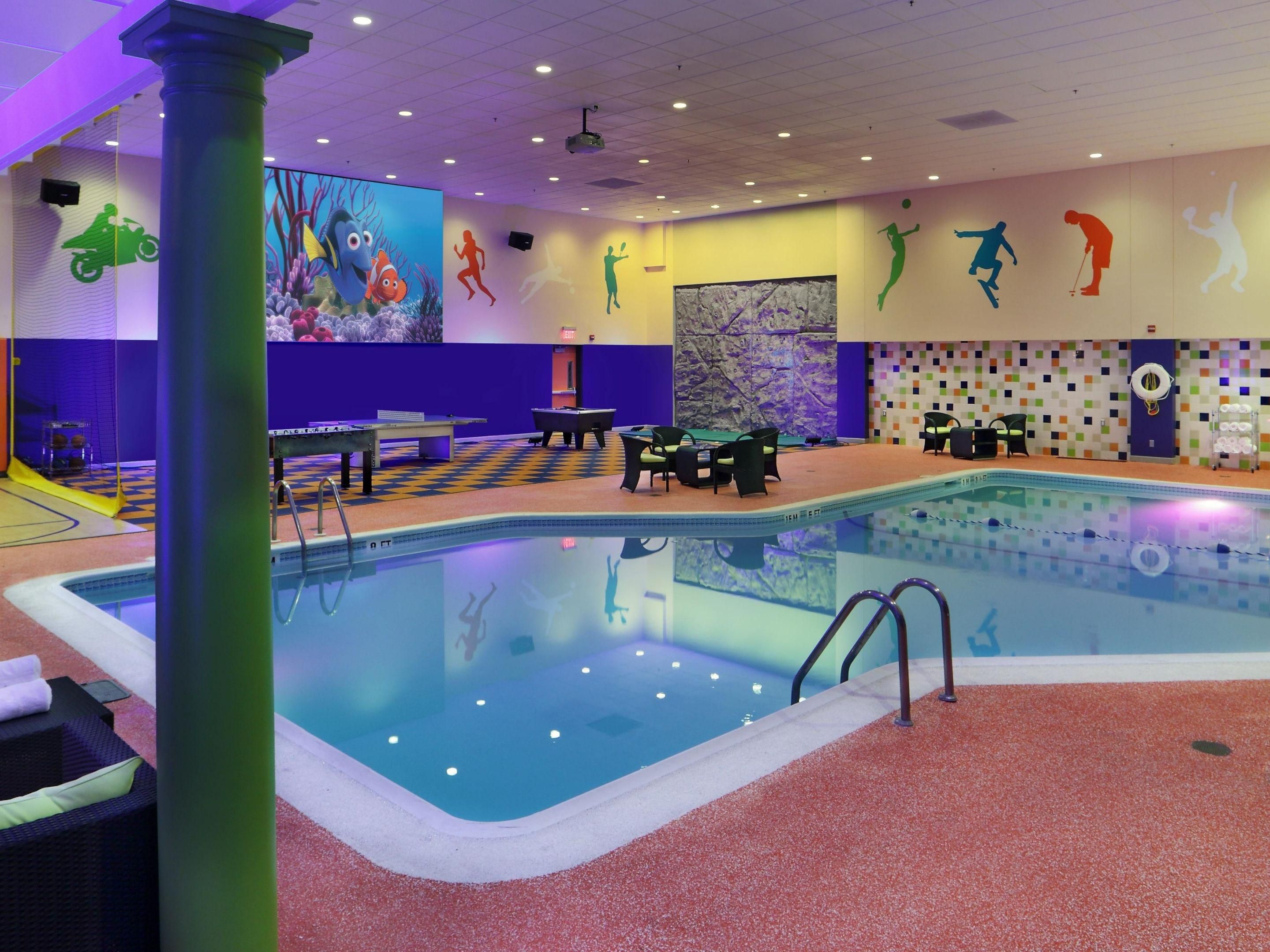 Spend time relaxing or swimming laps in our heated indoor pool. Hang out in a poolside lounger or cabana and enjoy "dive in" movies on the 16-foot screen on Friday and Saturday nights. Play on our Sports Deck, featuring a rock climbing wall, ping pong, bumper pool, and a free-throw basketball court, perfect for unwinding or playing with the kids.
