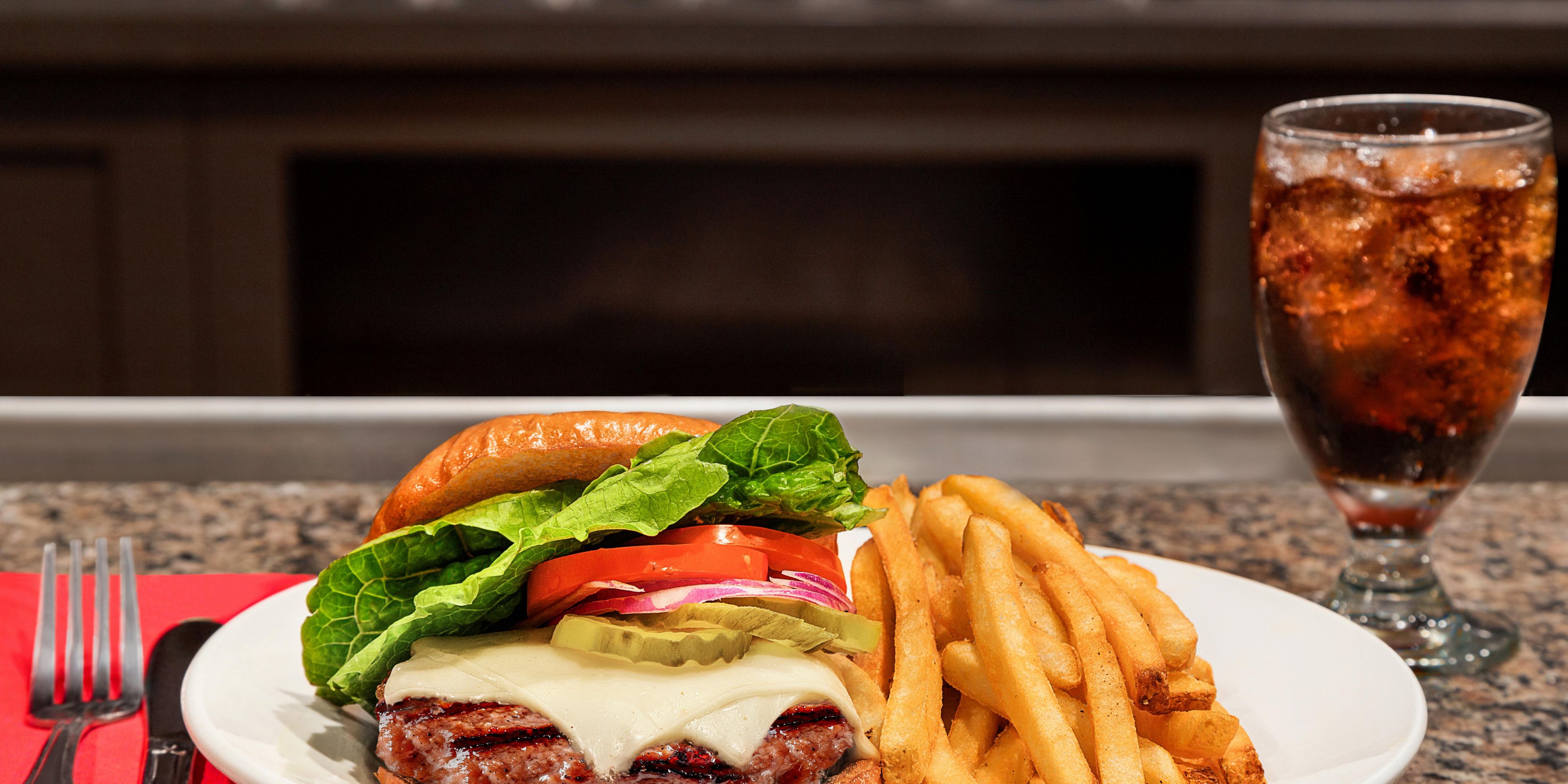 Order the juicy Cheeseburger in our restaurant, DRAFT.