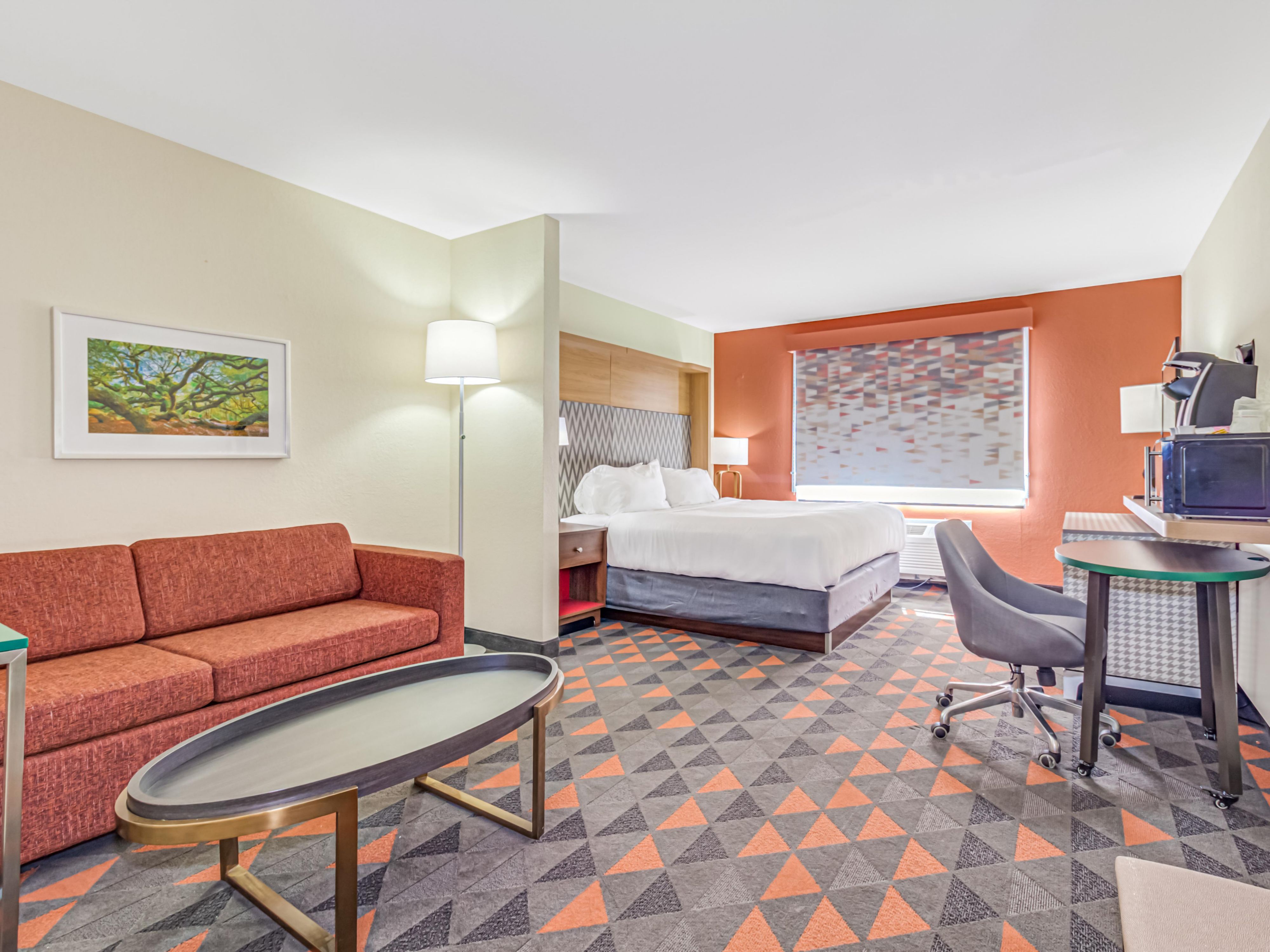 Dream big in our  King Bed Premium Guest Room with a Sofa.