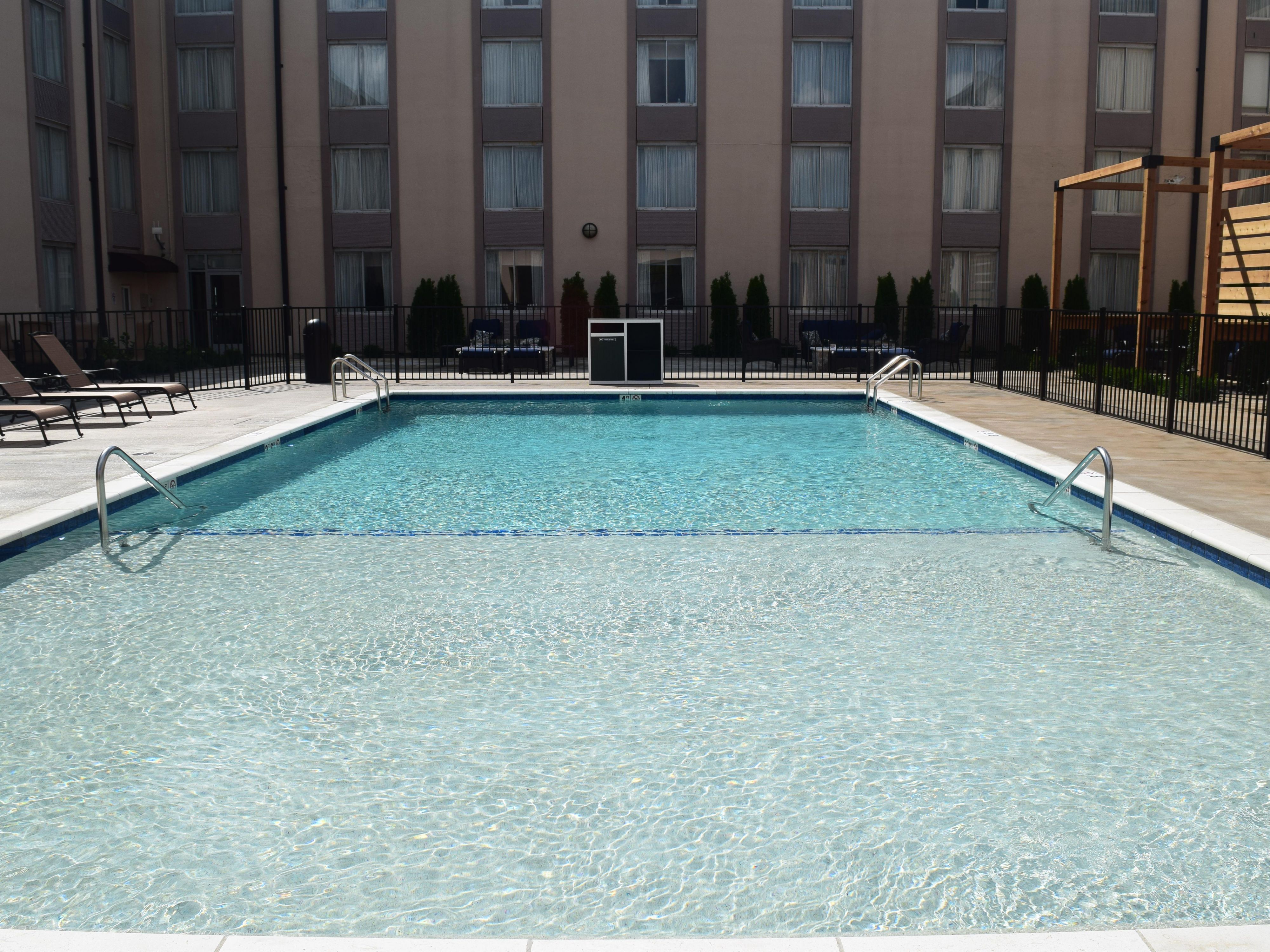 Take a refreshing dip in the spacious outdoor pool at our St. Louis hotel. Whether you prefer lounging in a comfortable poolside chair or splashing with the kids, it's the perfect spot to relax after a day of exploring the city or attending meetings. Swim laps, unwind with a good book, or just enjoy the hum of the city around you. 