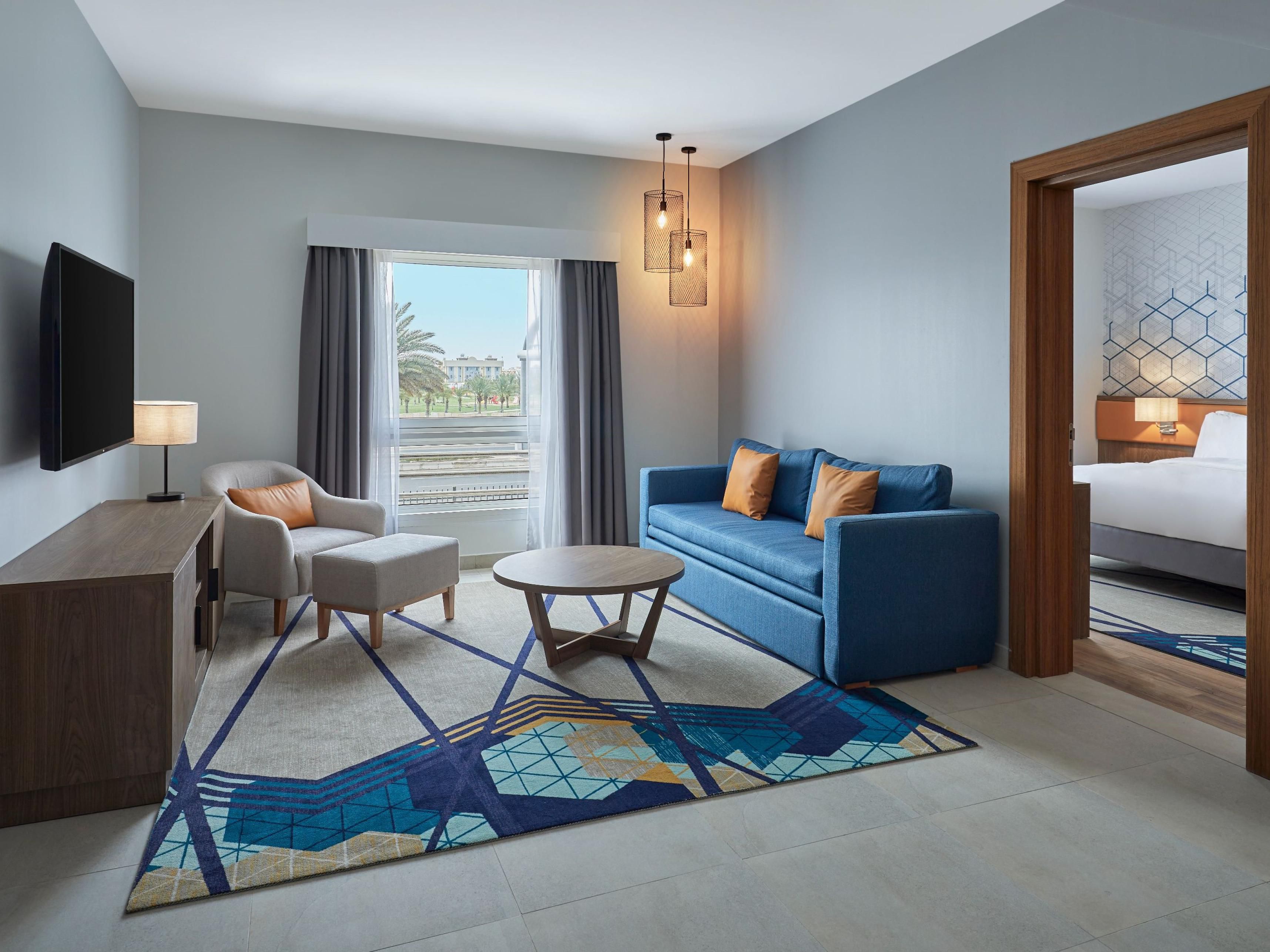 Our elegantly designed suites are the perfect place to reward yourself and get away for a relaxing stay with your loved ones. Spacious living room and plush bedding with modern amenities