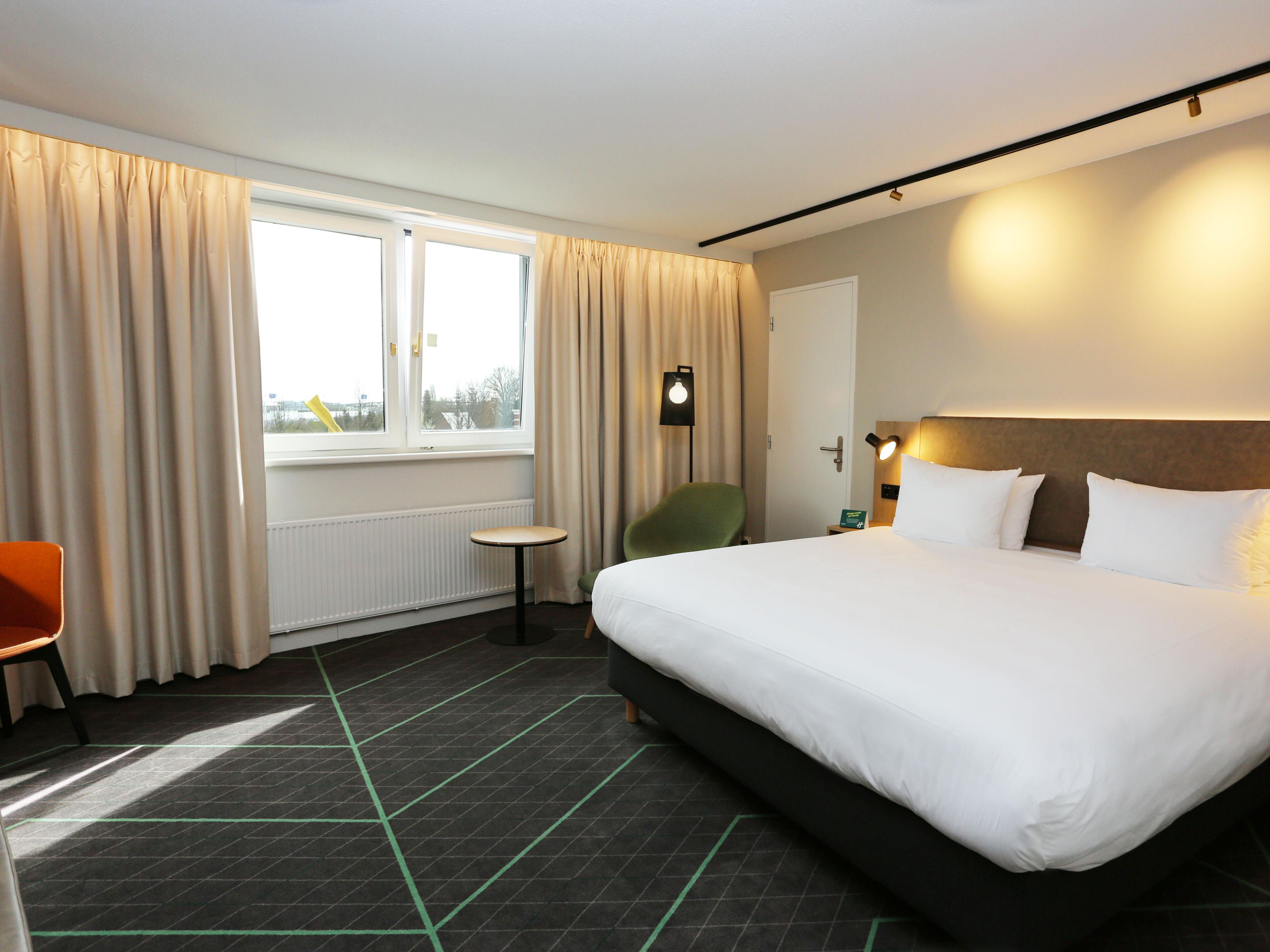 Look at our king size bed room with lazy chair!