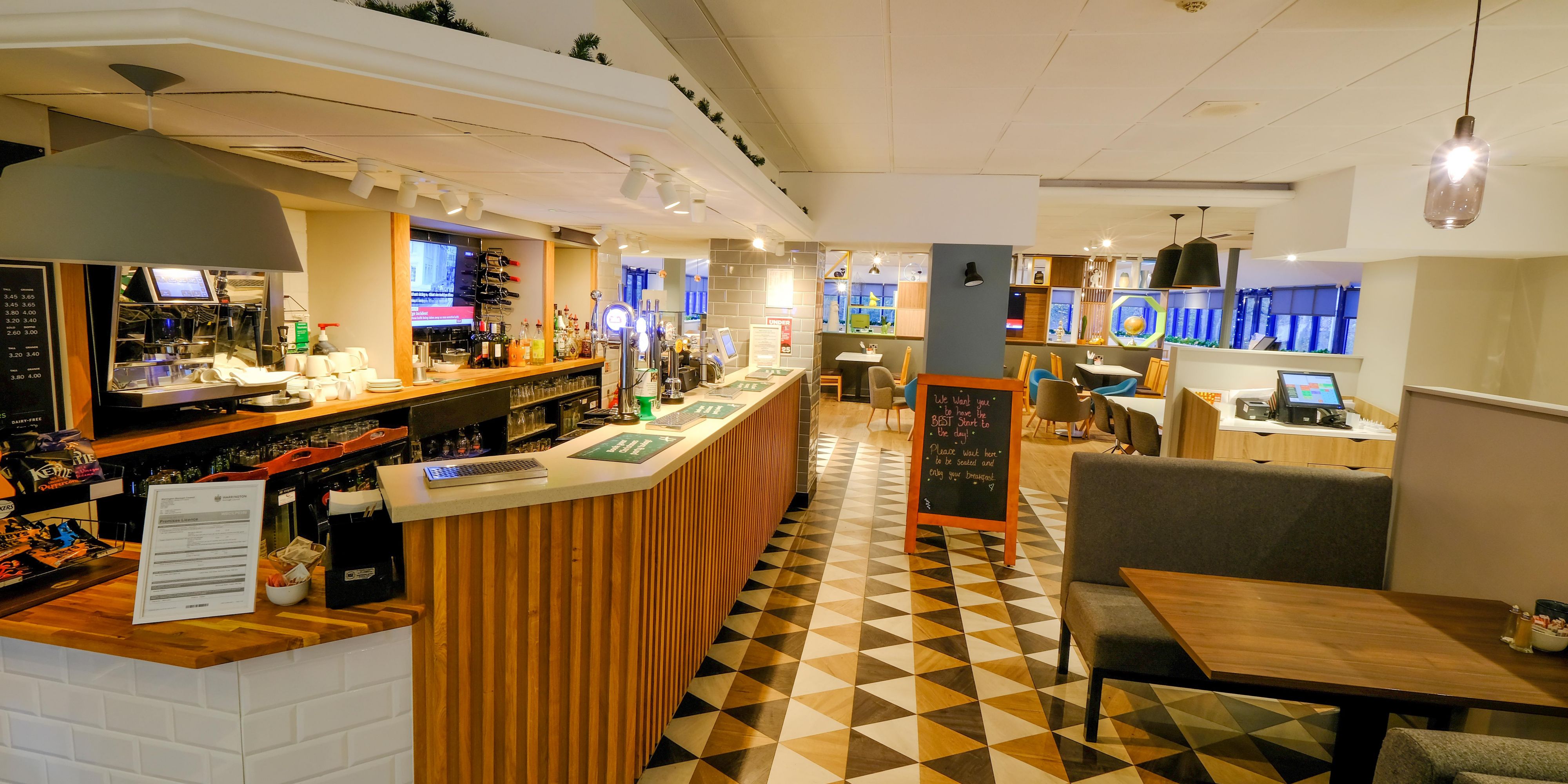 Enjoy a refreshing drink in our modern Open Lobby Bar.