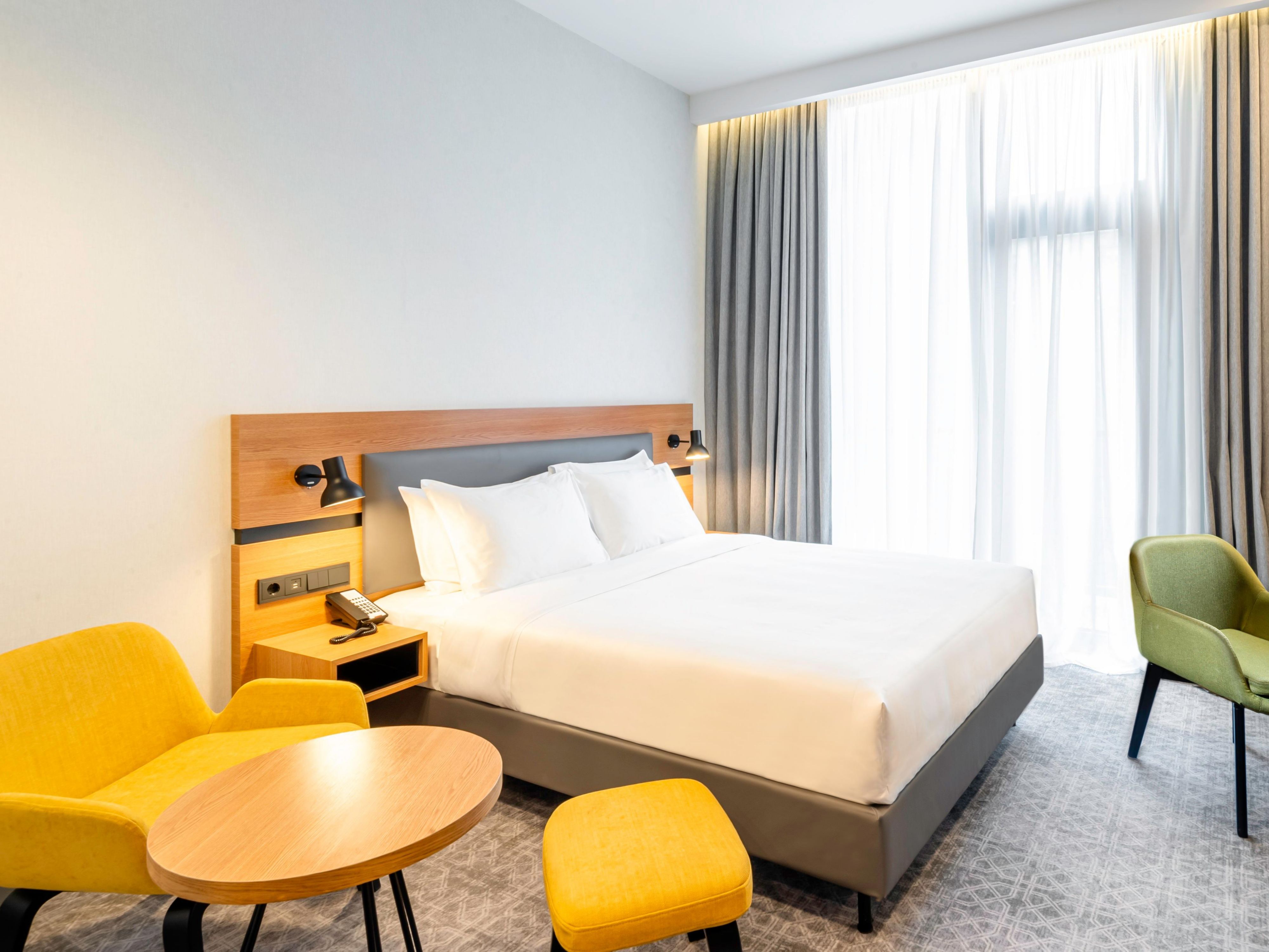 Standard Room with Queen size bed features small French balcony