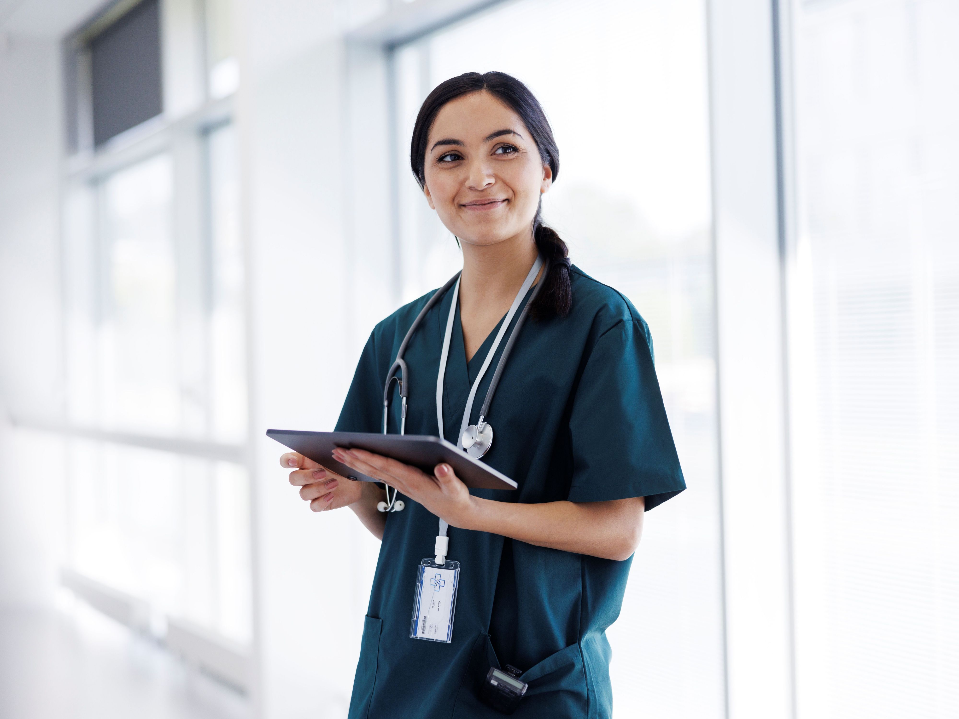 Woman in scrubs at hospital 