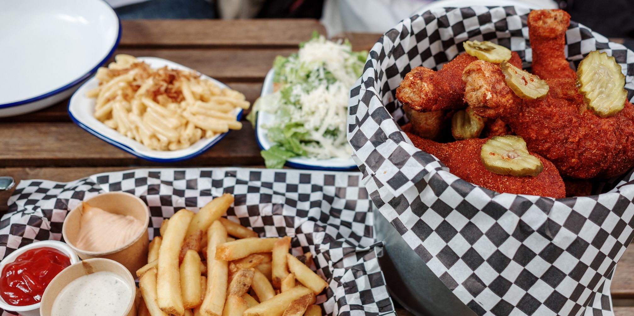 Fried hot chicken wings and fries