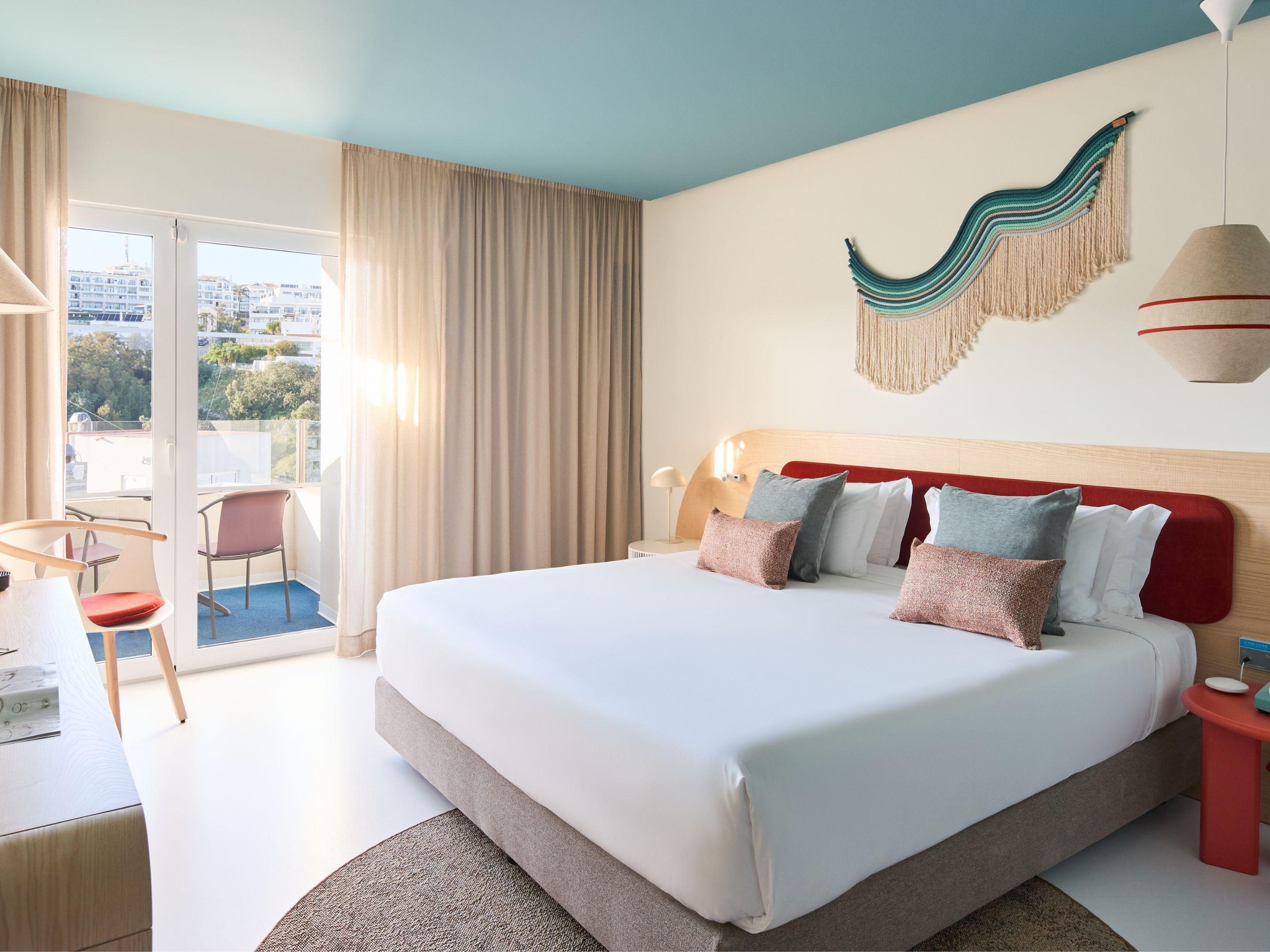 Cosy up in a king-sized bed at the Hotel Indigo Albufeira.