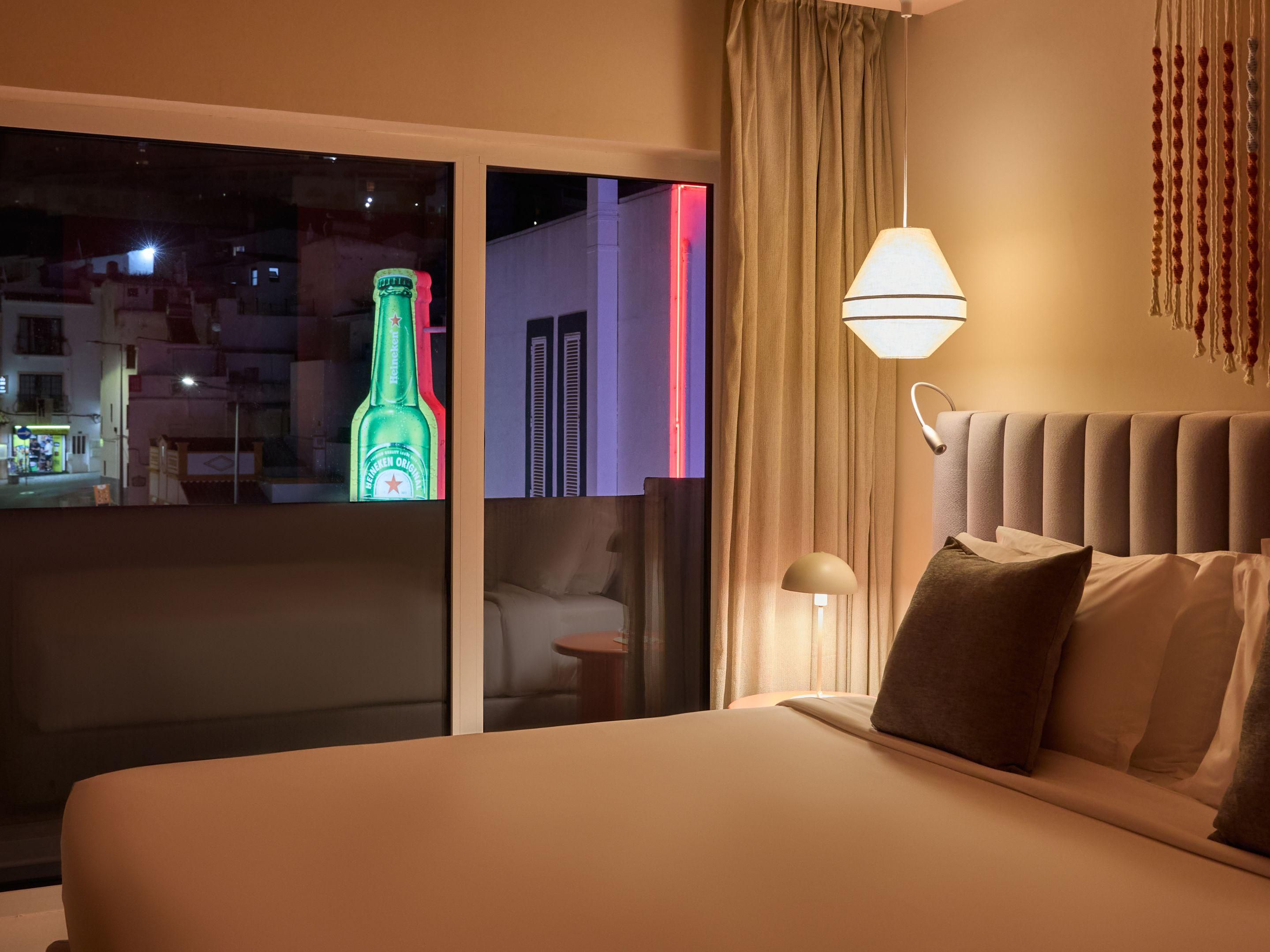 Feel the city pulse from your nightlife-facing room