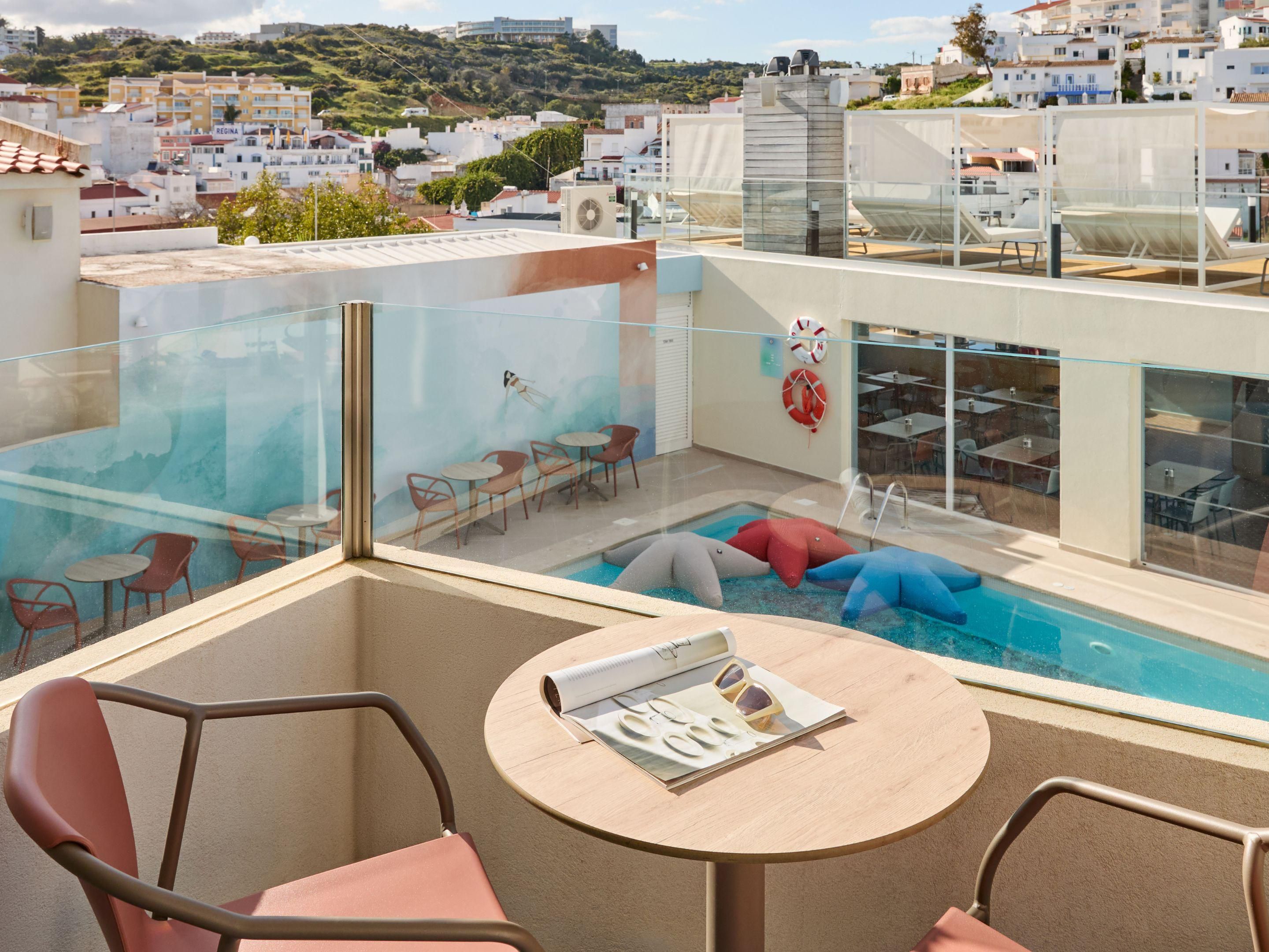 Enjoy a poolside table and bar in the nice Portugal weather.