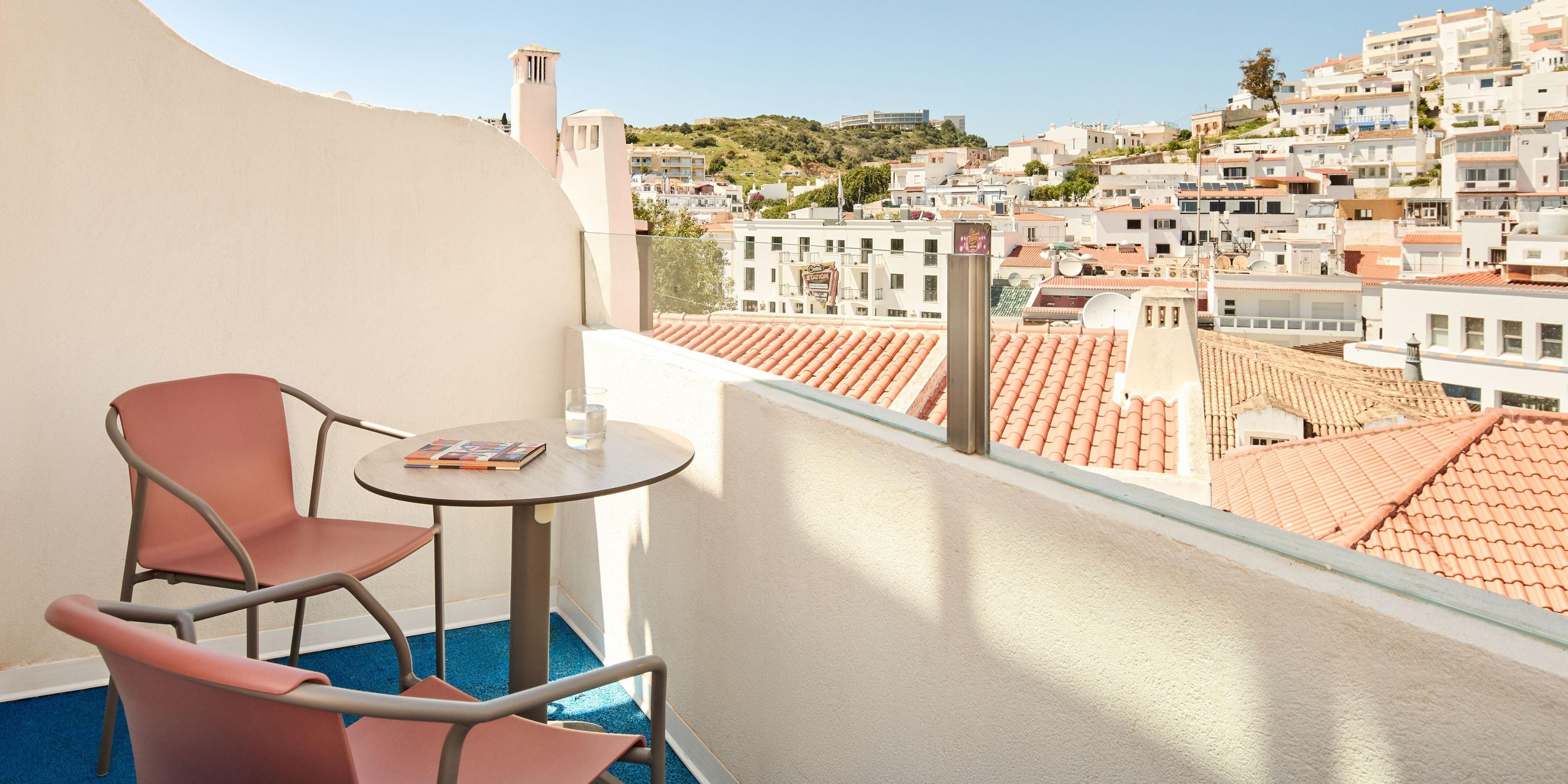 Soak up the city vibe from your stylish balcony