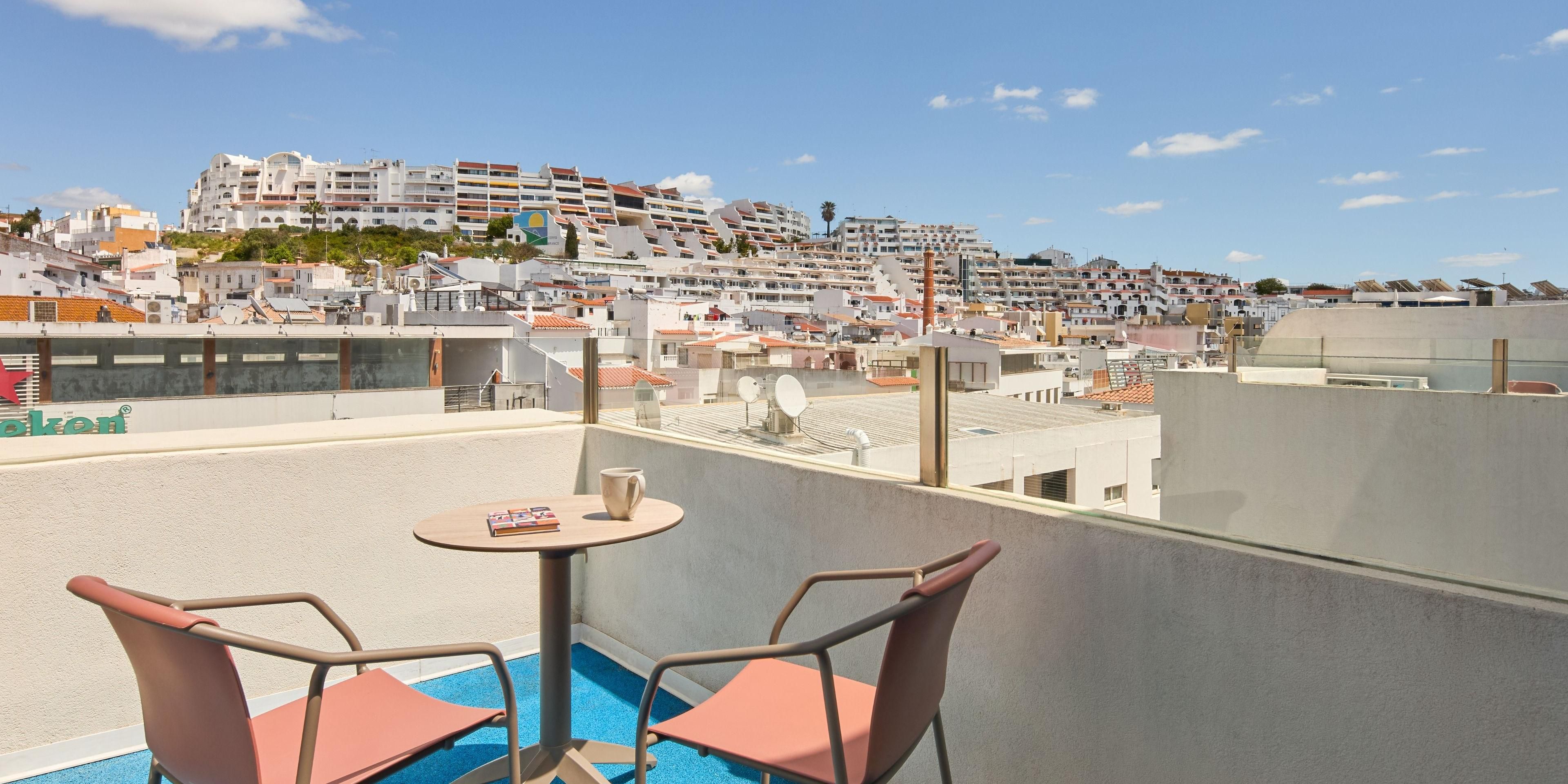 Soak up the city vibe from your stylish balcony