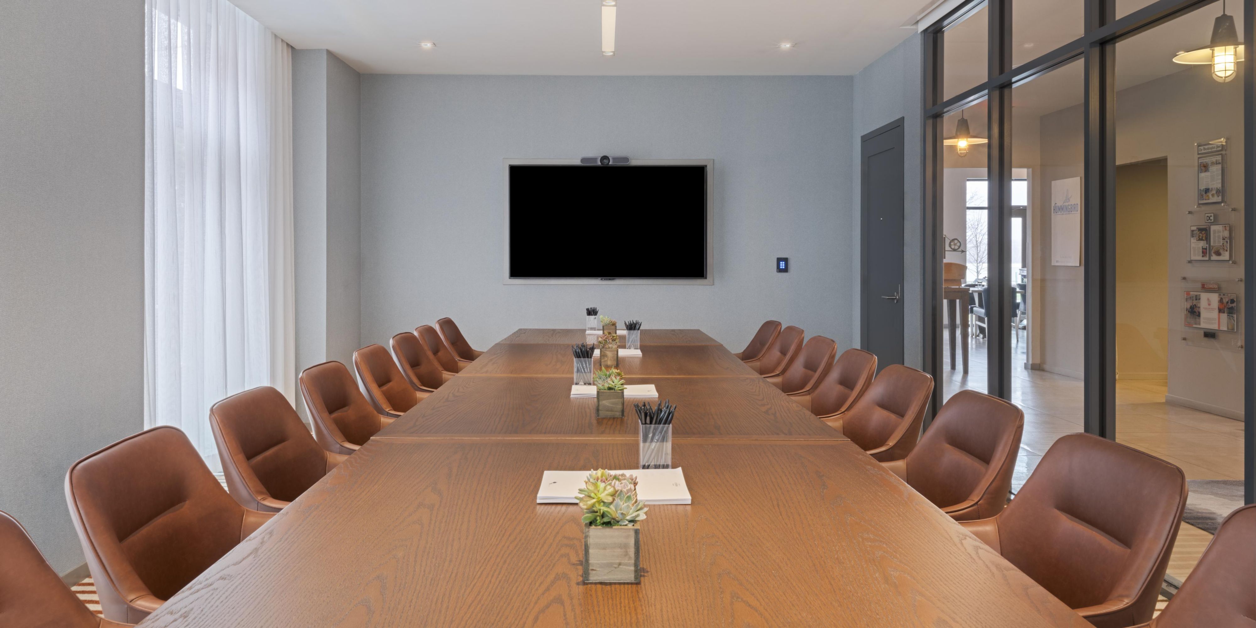 Boardroom with U-shape table and chairs