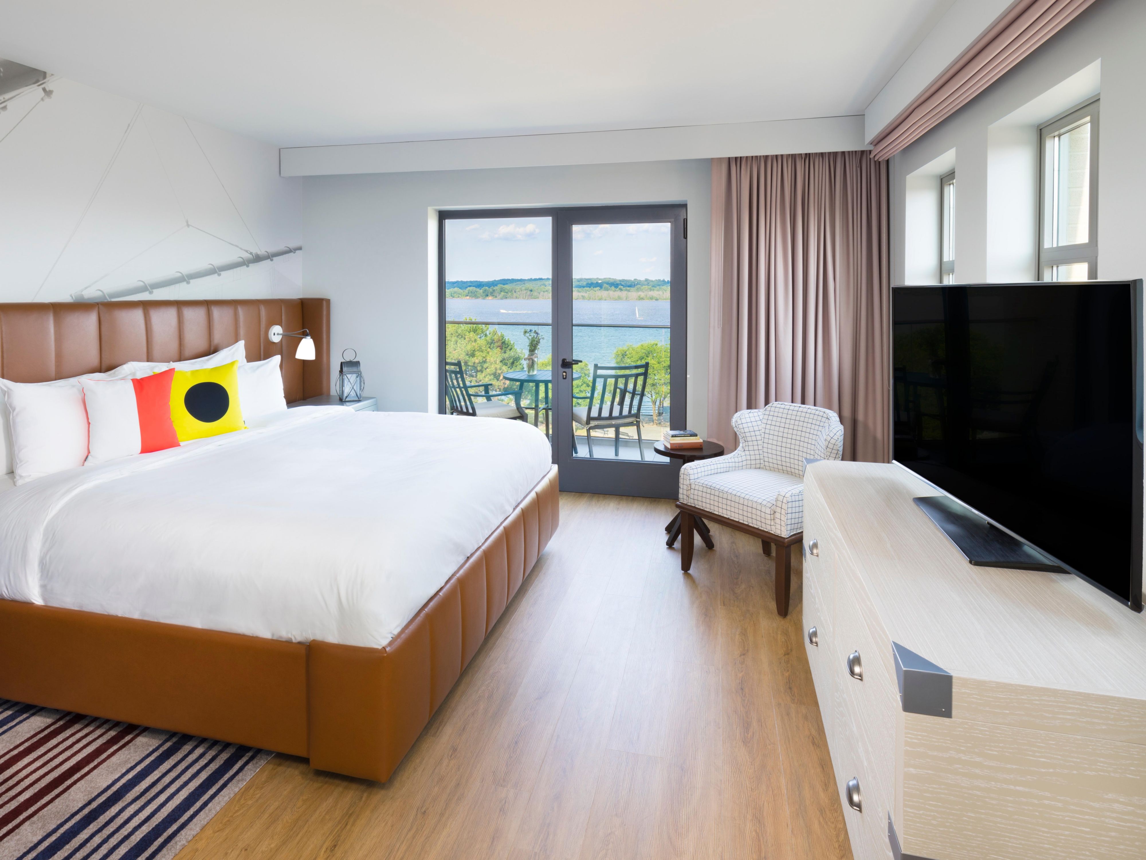 Enjoy beautiful views of the river from your balcony room