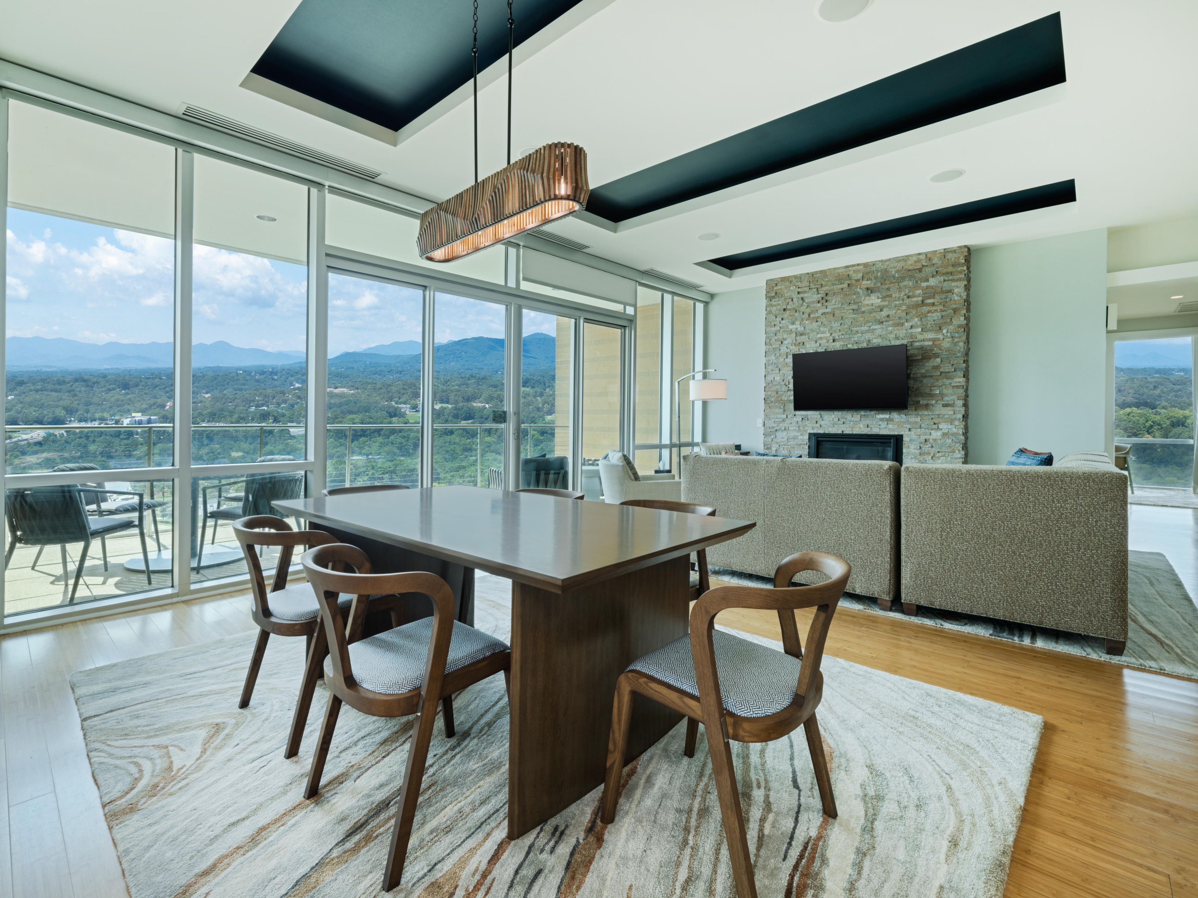 Condo living spaces with access to a private balcony