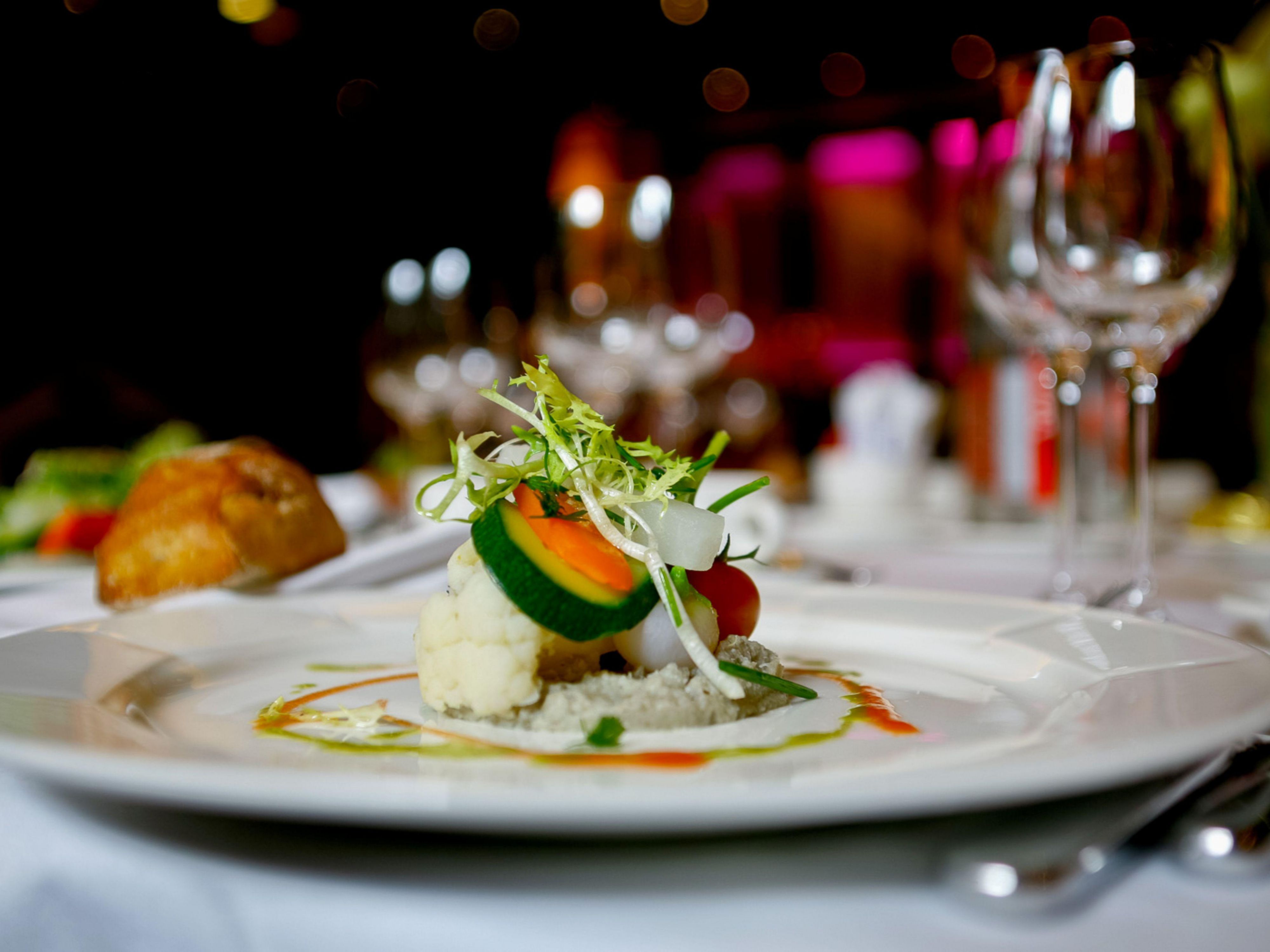 Gourmet vegetable dish plated in an elegant setting.