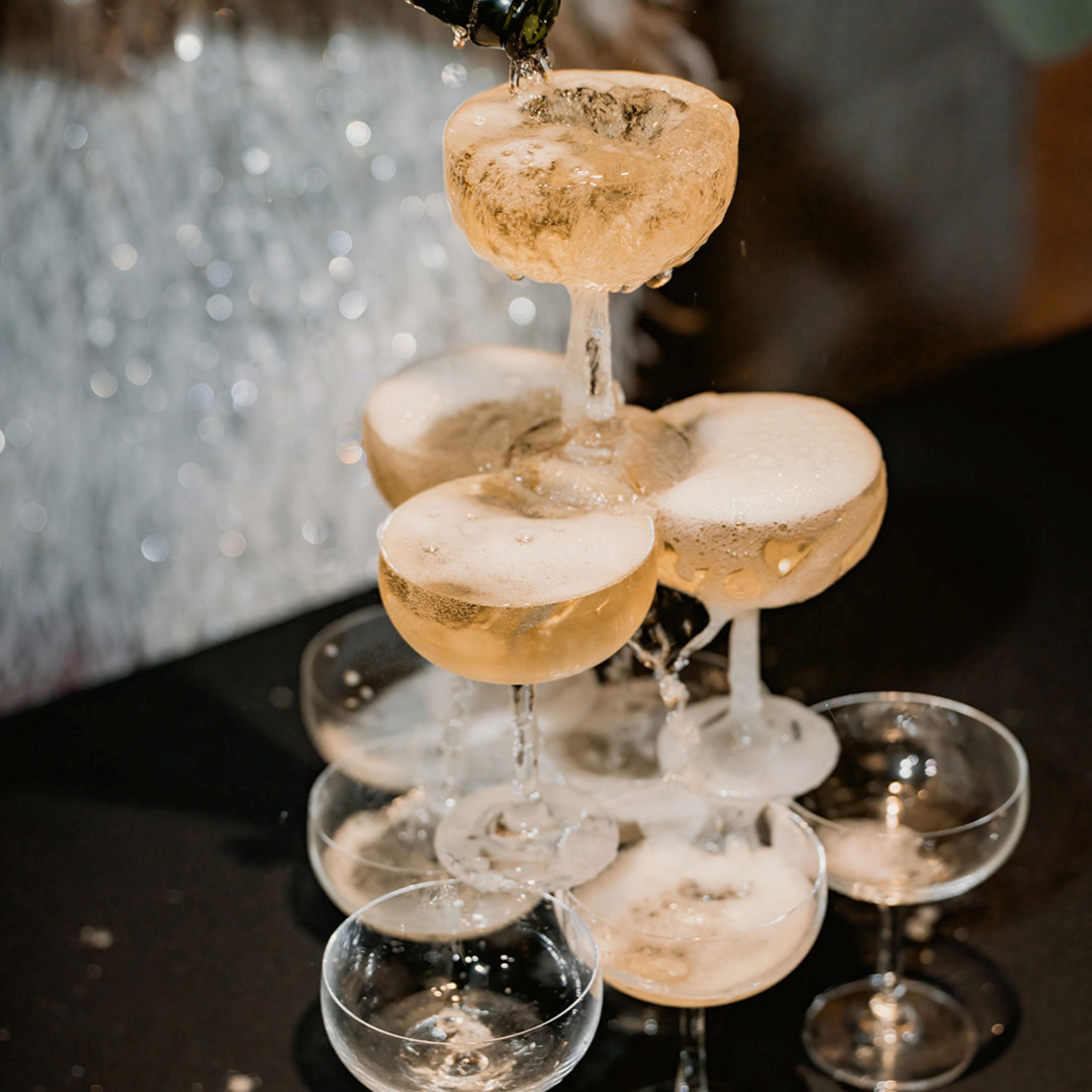 Toast to forever with a sparkling champagne tower.