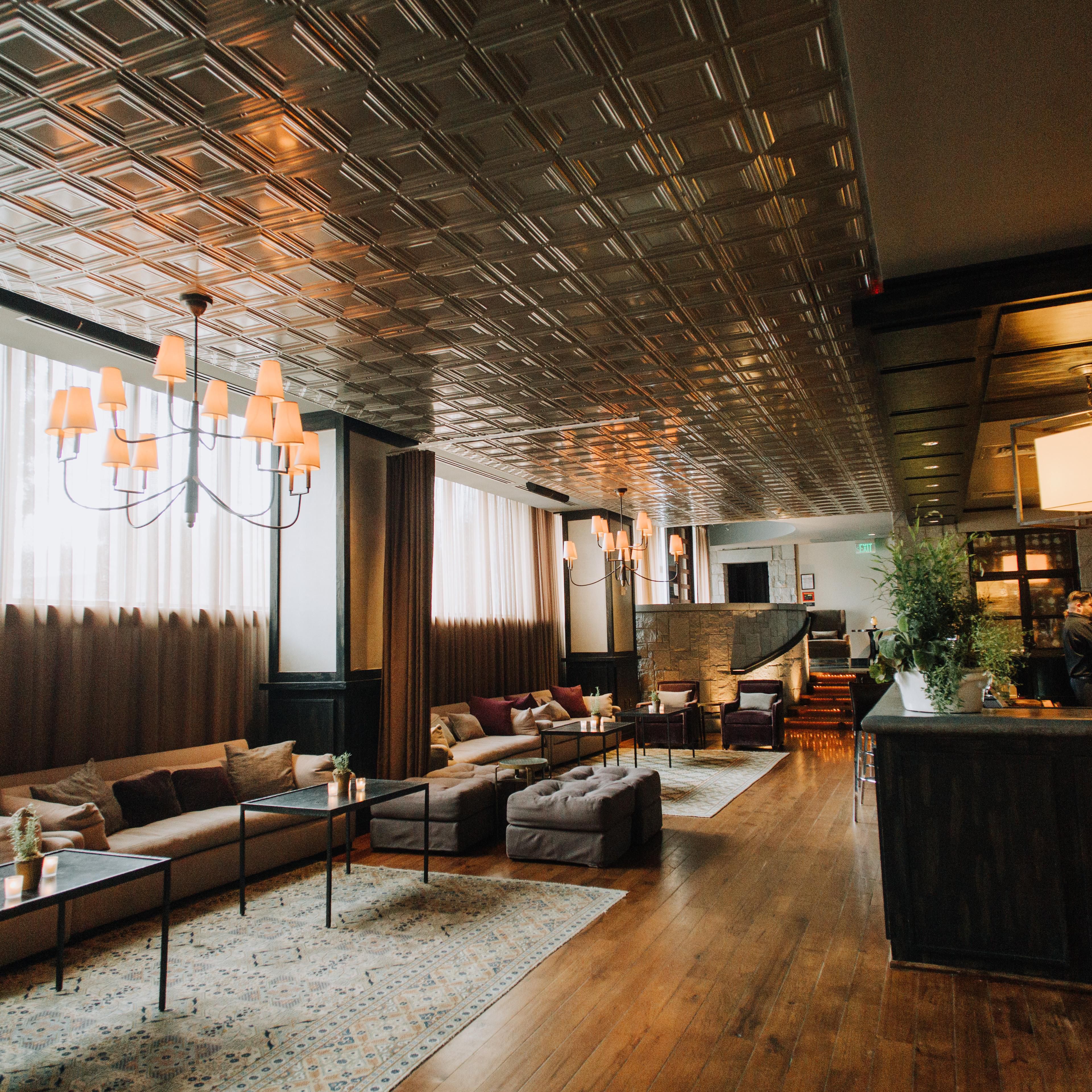 Elevated view of a long bar and plush lounge seating area.