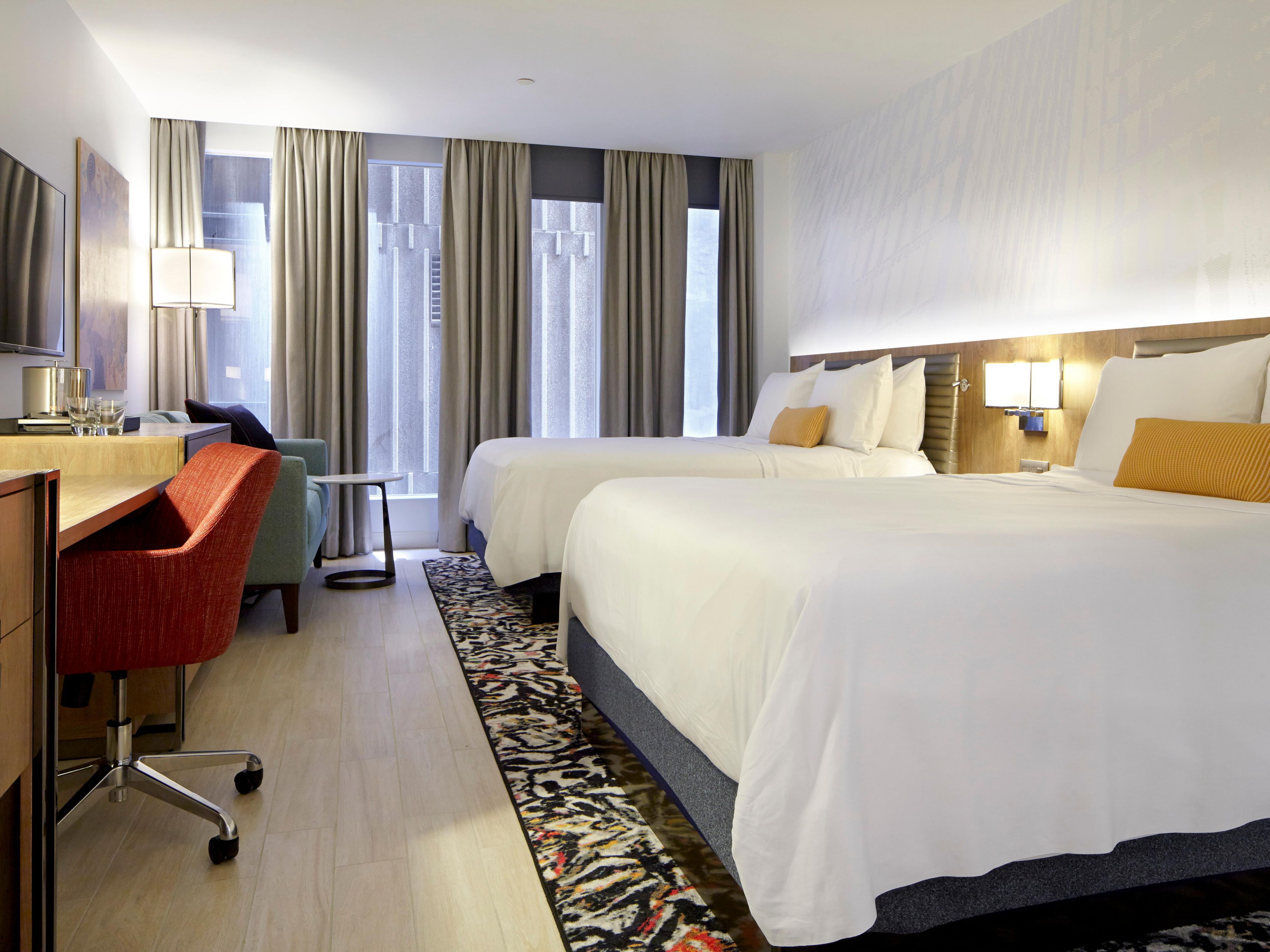 After working at the desk, curl up on our triple-sheeted bed. 