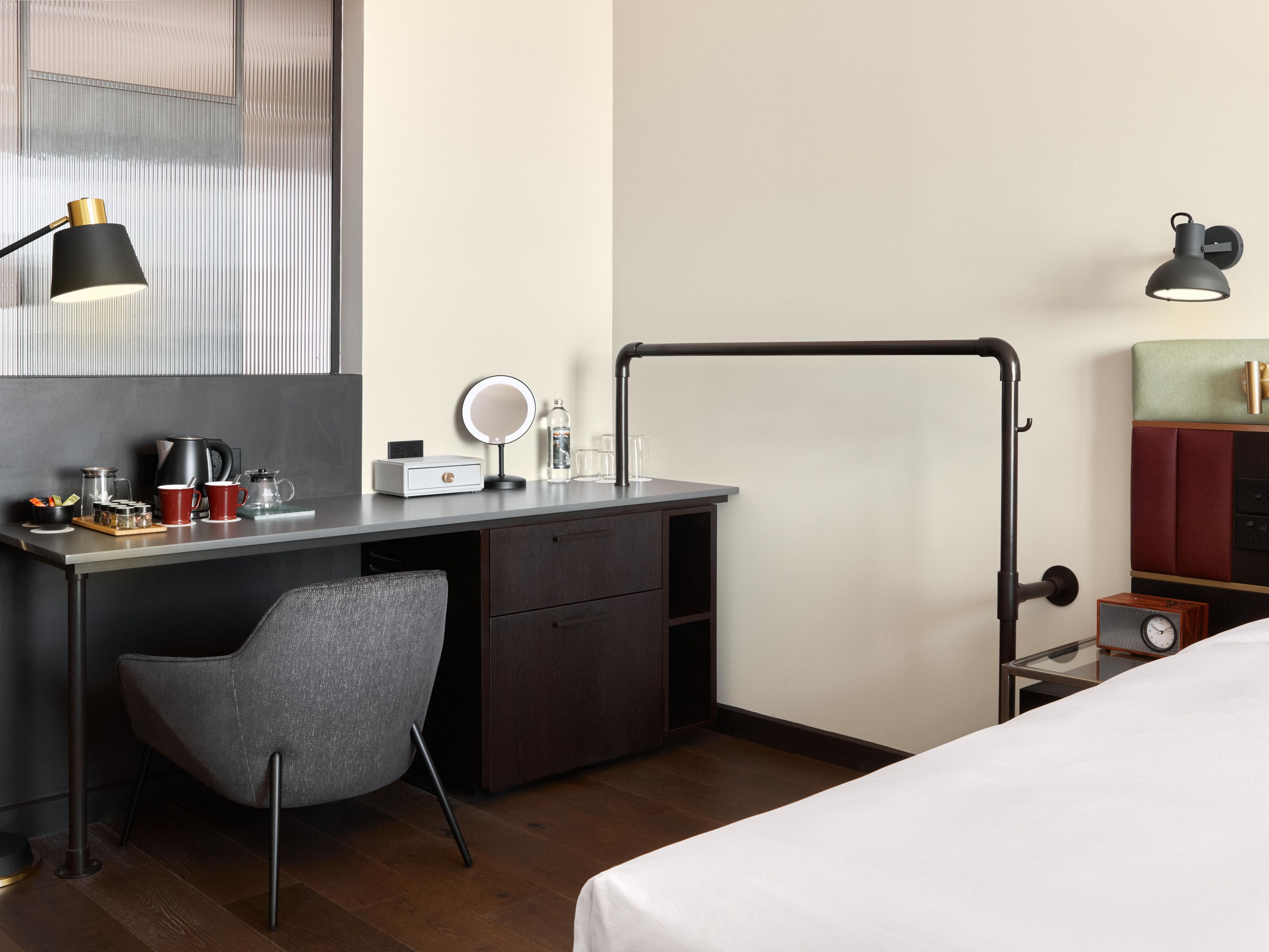 Modern hotel room with sleek desk and comfy bed